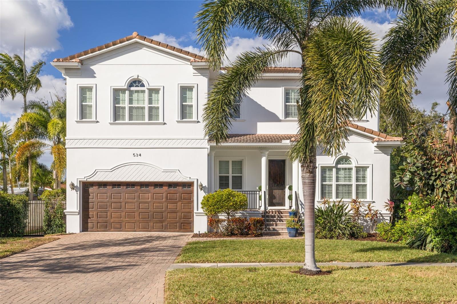 Let this sink in, we are one of only four MOVE IN READY homes on Davis Islands! This Mediterranean Revival single-family home is the perfect compliment of modern living with historical roots. Offering 3,943 square feet of living space, the residence features 5 bedrooms, 4.5 baths as well as a dedicated office. Designed with style and functionality in mind, the home includes an open concept, high ceilings, large living spaces, beautiful hand scrapped cherry wood flooring and wonderful out space. The heart of this home centers around the gourmet kitchen with a large central island for meal prep and dining, custom buffet/bar with glass cabinet storage and wine fridge, wood cabinetry, Viking brand stainless appliances, storage and a casual dining nook. The first floor layout features a spacious great room, with French doors leading to the backyard, a separate formal dining room, flex space between the kitchen and living area, office with built-in’s, full pool bath with direct access from the lanai as well as an additional guest half bath. The second level consists of an expansive primary suite with crown molding, on suite bath with a large walk-in shower, soaking tub, and dual stone vanities as well as an oversized closet. There are three additional large guest bedrooms, each connected with a Jack-n-Jill bath as well as a full size media room, which can serve as a 5th bedroom. Outdoors, the home shines with a salt-filtered pool and spa, a well sized covered and screened lanai, paver pool deck and artificial turf for low maintenance, hard wired gas grill with Green Egg. Additional features; exterior painted (2024), barrel tile roof, home Generac generator 22KW, elevation of 10’7”, and two-car garage with Tesla charging station. Located on Davis Islands, this home is part of a vibrant community known for its upscale, walkable lifestyle. Residents enjoy amenities such as the Marjory Park Marina, Sandra Freedman Tennis Complex, Peter O. Knight Airport, the historic Roy Jenkins Pool, and walking trail. The community also offers proximity to Water Street, Sparkman Wharf, the Tampa Riverwalk, and Tampa General Hospital, making it a city within a city while maintaining its laid-back island charm. This home is located within the boundaries of Tampa’s top-rated schools, including Gorrie Elementary, Wilson Middle, and Plant High School.