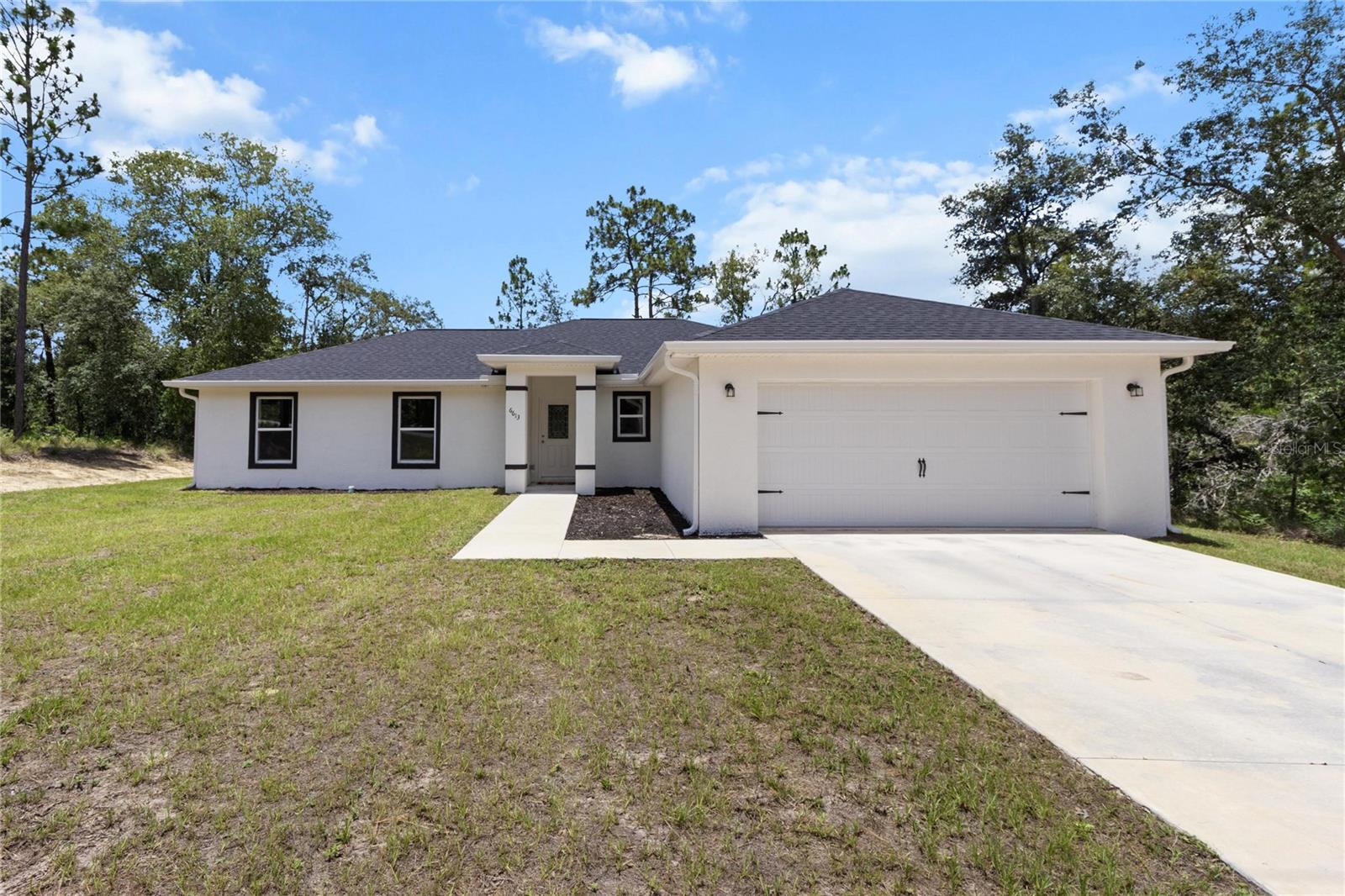 Come and GROW on Bedstrow! Here is a chance to own a brand new, semi-custom build, with a list full of upgrades. This home includes the following custom features/upgrades that the seller already paid for. Some of these features include a screened-in lanai, a decorative glass front door, and gutters already added. Bonus kitchen cabinets to the left of the sink, taller upper cabinets with custom crown molding, upgraded soft-close hardware, and a deep tub sink—all finished with matching quartz countertops in the kitchen and bathrooms. Additional highlights include an automatic garage door opener, sleek black faucets throughout, a deep soaking tub in the guest bath, and custom tile-work in both the master shower and guest bath. The guest bath also includes an exterior door for convenient access from outside. There is an exterior pool fixture just outside the master bedroom for a future pool installation. This is 10s of thousands of dollars of added value to the house. Inside you will find a tastefully designed 4/2 with tons of upgrades and a split floor plan. The kitchen opens up into the living room making it a great area to have friends and family over for a visit. There are many trails, boarding and training locations all around. There are some awesome local fishing spots to explore, great biking trails and bird watching sanctuaries near by. You will be close enough to the water to enjoy and far enough away to be safe (HIGH AND DRY). Don't miss scallop season. Some of the best fishing in the world can be found in our rivers, lakes and bays. you can catch a bass, crappie, trout, red fish, snook, grouper, mackerel, black sea bass and scallops.... all on the same trip. Bring your pole, goggles, scallop bag and more to stay busy year round. There are plenty of fantastic options when it comes locally owned cuisine and shops that are sprinkled throughout the area. Citrus County will be a joy to visit and certainly worth a second look! Also, the centralized location makes for a short trip to Ocala (HORSE CAPITAL OF THE WORLD), Gainesville, Tampa, St.Pete, Orlando and the rest of the beauty that Central Florida has to offer. Citrus County has 9 public and 5 private golf courses for your playing pleasure. Among those courses is the world renowned Black Diamond and the recently built Cabot Farms. All courses are a short drive away.
