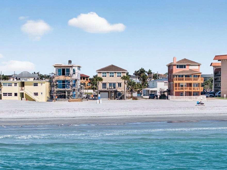 Welcome to a truly rare Gulf-front opportunity in the heart of Redington Shores—where panoramic water views, breathtaking sunsets, and the beauty of Florida’s coastline come together in perfect harmony. Built in 2015 with solid concrete block construction on the base level and designed to FEMA standards, this home offers both peace of mind and lasting quality. From the moment you arrive, you are welcomed by unobstructed, panoramic views of the Gulf from every level of the home. With approximately 40 yards of pristine sugar sand beach directly in front of you, the setting feels both expansive and private—your own stretch of paradise along the shoreline. What truly sets this home apart is the experience it offers each evening. The sunsets here are nothing short of extraordinary—endless skies painted in vibrant hues of gold, pink, and orange, reflecting across the water as the day gently fades into night. Whether you are relaxing on your balcony or entertaining guests, these nightly sunsets become a breathtaking backdrop to everyday living. The home is thoughtfully maintained and move-in ready, featuring numerous updates including two new air conditioning systems, a new electrical service installed by Duke Energy, a new water softener system, and a brand-new washer and dryer. Hurricane roll-down shutters on the Gulf-facing sides provide additional protection, while LED lighting and blackout blinds add efficiency and comfort for laid-back beach living. The structure itself remains strong and sound, offering confidence in its construction and longevity. The roof and overall structure remain in excellent condition, further reinforcing the quality of the home. Situated on a quiet cul-de-sac just off Gulf Boulevard, the location offers a rare blend of privacy and convenience. There is also the opportunity to add a pool, further enhancing your outdoor living space and creating a true coastal retreat. Redington Shores is known for its relaxed coastal charm and its beautiful, uncrowded sugar sand beaches. Unlike more heavily traveled areas, this community offers a peaceful and serene lifestyle while still being close to local dining, shopping, and entertainment. Here, life slows down: you can take long walks along the shoreline, enjoy the sound of the waves, and fully embrace the natural beauty that surrounds you. This is more than just a home—it is a lifestyle centered around waterfront living, unforgettable sunsets, and the simple luxury of waking up and ending each day by the water.