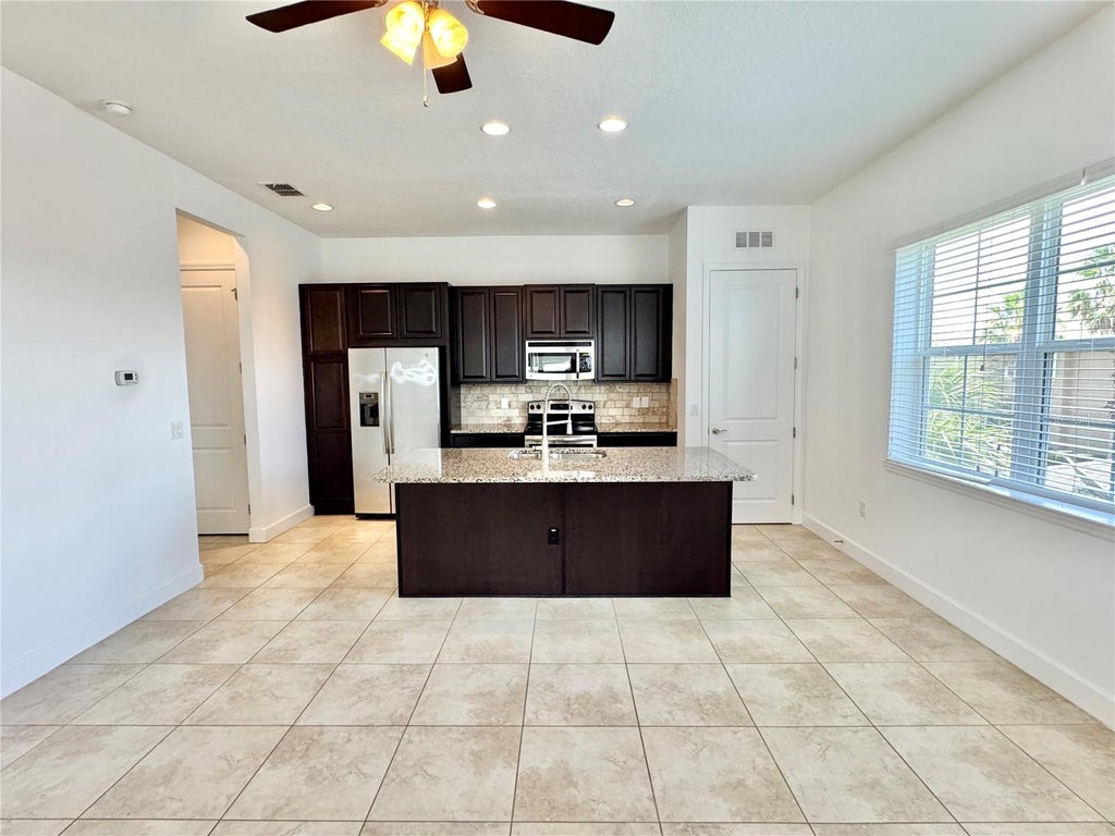 Photo of 14016 Dunant Lane, Orlando, FL 32827 (MLS # O6423533)