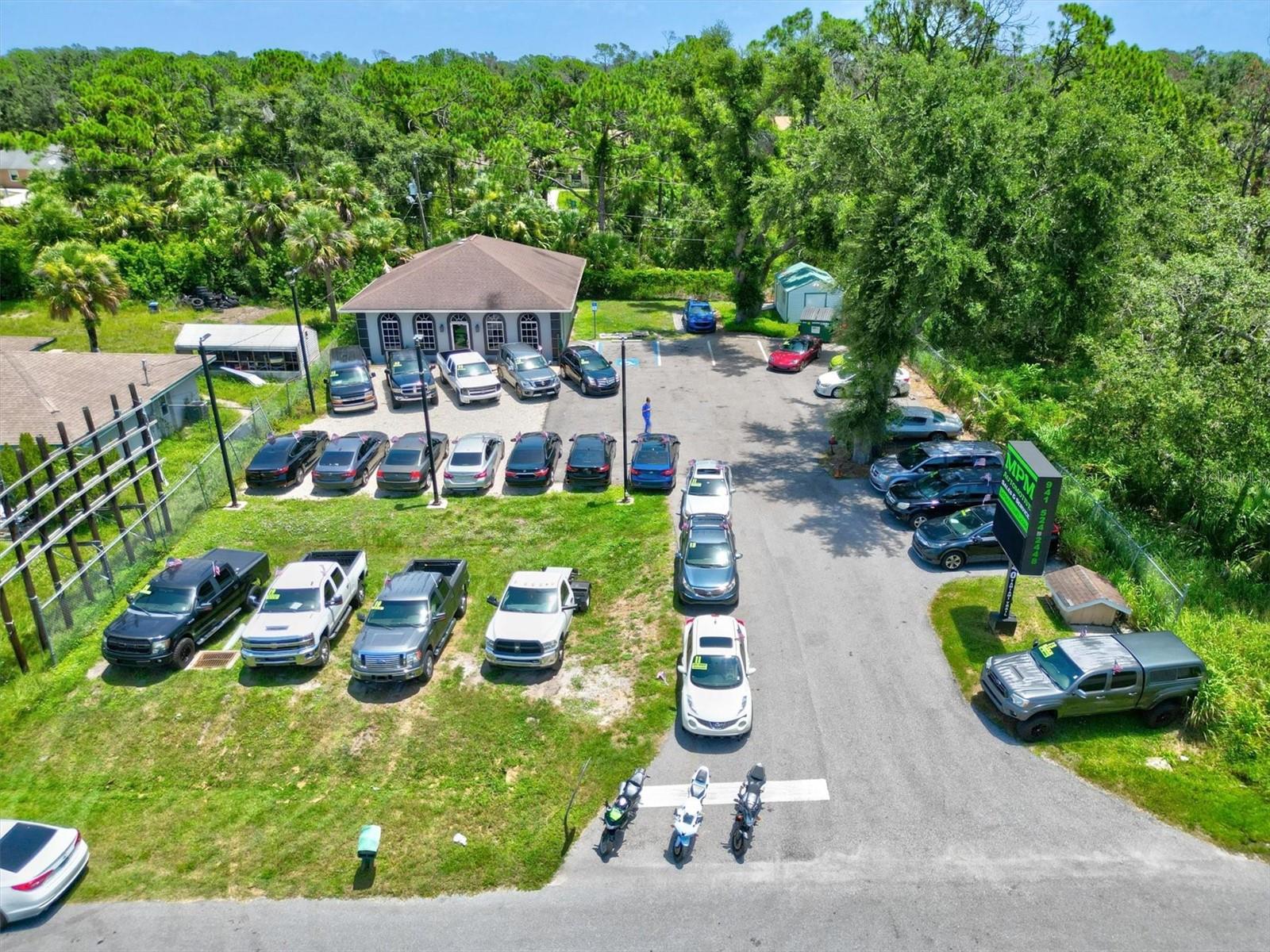 Lease with the option to Purchase! Rare Opportunity! Property has been totally remodeled! Rare Opportunity to own commercial property located on Tamiami Trail....5 Office spaces, 1 filing room could be used for another Office. 2 Bathrooms , Kitchen, Showroom/Waiting Room with 2 Outside sheds with electric. The parking lot has just been Paved. It has 30 parking spaces... Currently used as, Auto sales Business but would work for professional services, office, retail, investment opportunity! Move in ready and start your Business!