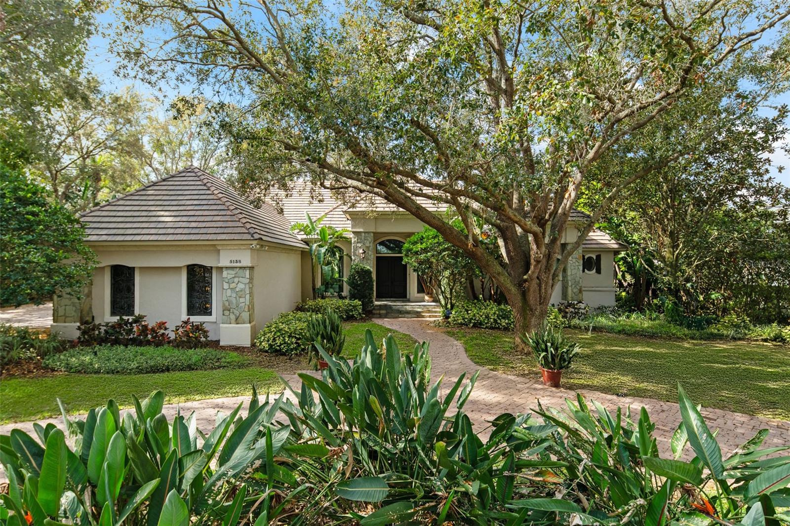 Under contract-accepting backup offers. A captivating golf course location sets the stage for a residence with so many possibilities. Welcome to Isleworth: Central Florida’s premiere golf course community. This single-story French country-style home spans more than 4,300 sq feet and boasts 4 bedrooms plus bonus or game room and sits on the 12th fairway of the completely redesigned and newly reopened championship course. With a view of Hourglass Lake beyond, this home takes full advantage of a prime half-acre lot along one of the neighborhood’s most desired streets. An updated kitchen is ready for entertaining with stainless appliances including a spectacular Thermador® 6-burner gas range with double ovens, Sub-Zero side-by-side refrigerator/freezer, double dishwashers, warming drawers, ice maker, and double island with preparation sink. The master bath was recently updated with Italian marble tile, rain shower, and soaking tub. Fitted with new high-quality Pella® windows, a 3-car garage, bonus room, and lanai with heated pool, slide and two waterfalls, and newer stand-alone Hot Spring ® Luxury spa. The 600-acre Isleworth community, surrounding the Butler Chain of Lakes, is a residential enclave that sets the standard of excellence for Central Florida living. On-site home services are available for a carefree lifestyle. Isleworth Golf and Country Club, which is located within the community, offers various membership opportunities and is recognized as one of the Top 100 Platinum Clubs of the World.
