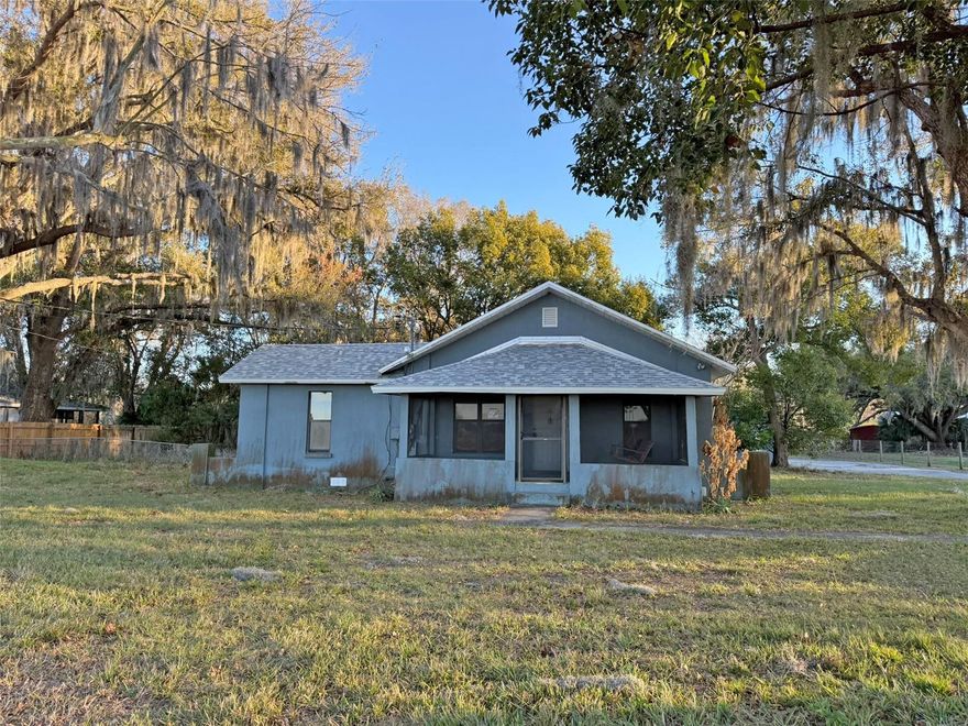 Country living on almost an acre! This home offers 2 bedrooms, 2 full bathrooms, a small bonus area and enclosed Florida room. There is a workshop with attached 2-car lean-to and plenty of space for parking. The roof was replaced in July of 2025. Located near Camp Margaritaville RV resort, Auburndale trail and Lake Myrtle Sports park.