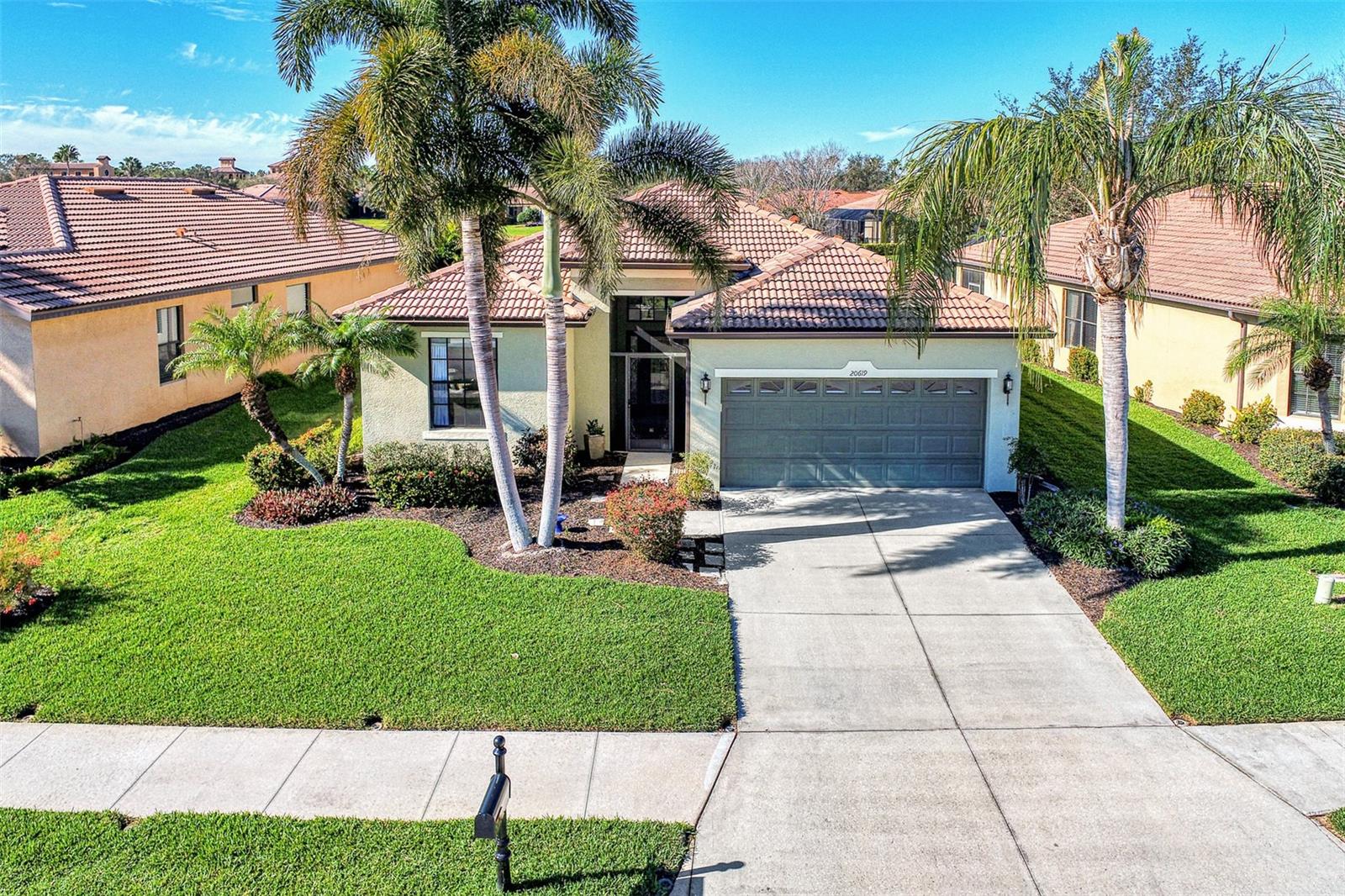 Dramatic New Price Alert !
Discover lakeside living at its finest in this stunning Florence model home, nestled in the sought-after 55+ gated community of Venetian Falls! This impeccably maintained 2-bedroom, 2-bathroom residence, with a versatile office/den, offers 1,916 sq. ft. of bright, open living space designed for comfort and elegance. Built in 2006, this home boasts modern upgrades and timeless charm, perfect for those seeking a vibrant yet serene lifestyle.
Step inside to a light-filled interior with no carpets—just beautiful tile flooring throughout the main areas. The dream kitchen is a chef’s delight, featuring a quartz waterfall-edge island, high-end appliances, and custom cabinetry, ideal for entertaining or everyday meals. The open-concept living area flows seamlessly to an extended lanai with automatic awnings, offering breathtaking lake views and the perfect spot for morning coffee or evening sunsets.
The primary suite is a true retreat, complete with custom closets and an upgraded spa-inspired bathroom. Additional highlights include built-in shelving in the office, custom window treatments, plantation shutters, and stylish custom fans and lighting throughout. Sliders at the back of the home enhance the indoor-outdoor connection, inviting you to enjoy the tranquil waterfront setting.
This home also features a two-car garage, low HOA fees (with no CDD fees), and includes landscaping, basic cable, and high-speed internet for effortless living. The vibrant Venetian Falls community, with 700 homes, offers a nearby clubhouse, on-site management, and a host of amenities to enjoy an active and social lifestyle.
Don’t miss your chance to own this move-in-ready masterpiece in a premier 55+ community, where lakefront luxury meets modern convenience. Schedule your private tour today and make this dream home yours!