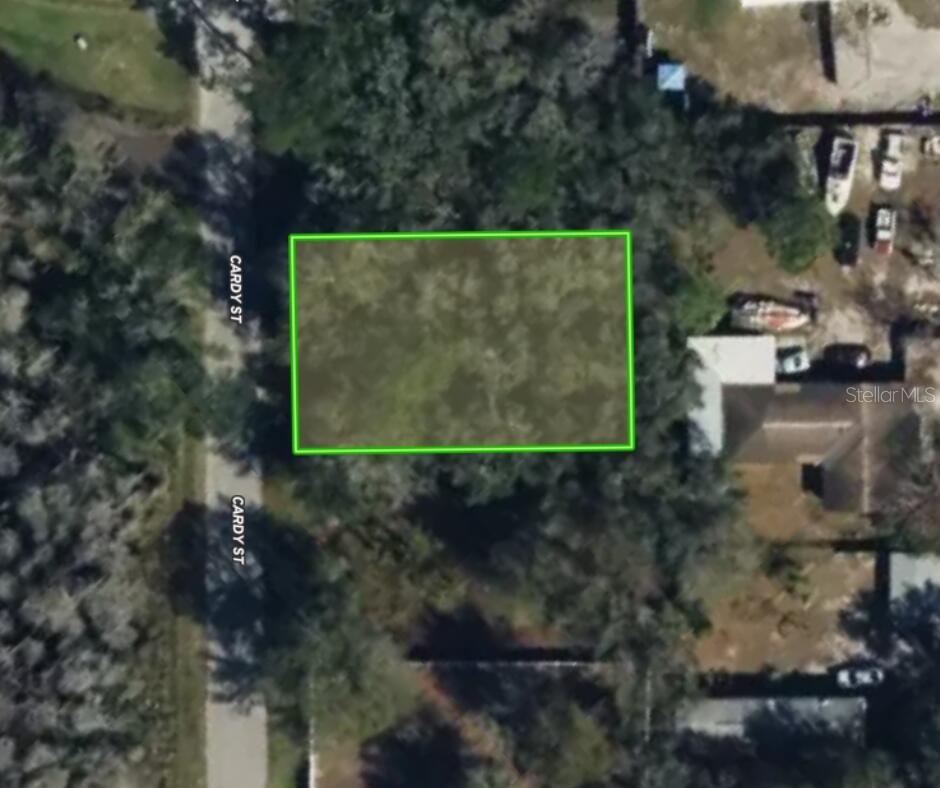 This 0.18-acre parcel on Cardy Street in Moon Lake Estates offers a versatile, buildable opportunity in a developing area of New Port Richey. With paved road frontage and a flat, wooded landscape, the lot is easy to access and ready for development. It’s zoned Agricultural Residential (AR), which allows for stick-built homes (minimum 210 square feet), modular homes, manufactured homes, mobile homes (minimum 12x40 feet), and tiny homes that meet Florida building code.
There is no HOA, no flood zone, and no wetlands, allowing for fewer restrictions and more flexibility for future use. While utilities are not yet installed, buyers will need to plan for a well and septic system. Electric/Power is available nearby.
The property is located just minutes from Moon Lake Park, where you’ll find a public boat launch, picnic areas, and nature trails. For additional outdoor recreation, Jay B. Starkey Wilderness Park is also nearby with miles of hiking and biking paths. Commuters will appreciate the proximity to Suncoast Parkway (SR-589), offering quick access to Tampa in under an hour. US-19 and FL-52 are also within easy reach, connecting you to shopping, dining, and essential services.
Buyer is responsible for all closing costs, PERC testing, and installing all utilities (electric, well & septic). Don’t miss the chance to make it yours!