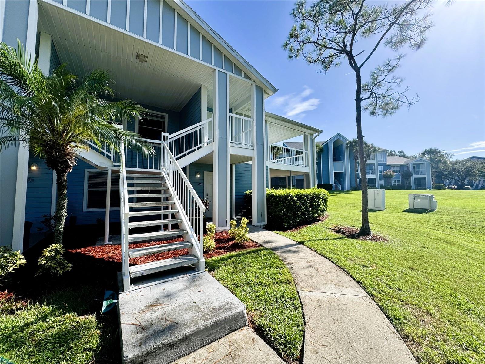 Welcome to this charming 1-bedroom, 1-bath corner unit on the second floor, located in a secure, gated community in Lake Mary, FL. With no neighbors above, enjoy peaceful living and enhanced privacy. The home features a bright front porch and wrap-around balcony, allowing you to relax outdoors while enjoying scenic views. Inside, the vaulted ceilings in the great room—accentuated by multiple windows and a single-light French door—flood the space with natural light, creating an airy and open ambiance comfort and convenience are key: the unit includes an in-unit laundry room with washer and dryer, so no trips to shared facilities Situated in Lake Mary, a serene and well-maintained community, the property offers controlled, gated access and beautifully landscaped surroundings away from congestion yet close to major amenities and top-rated schools also -Community features include a gym, 2 swimming pools, tennis & basketball courts. All applicants are required to do a credit and background check. Renters insurance is required.