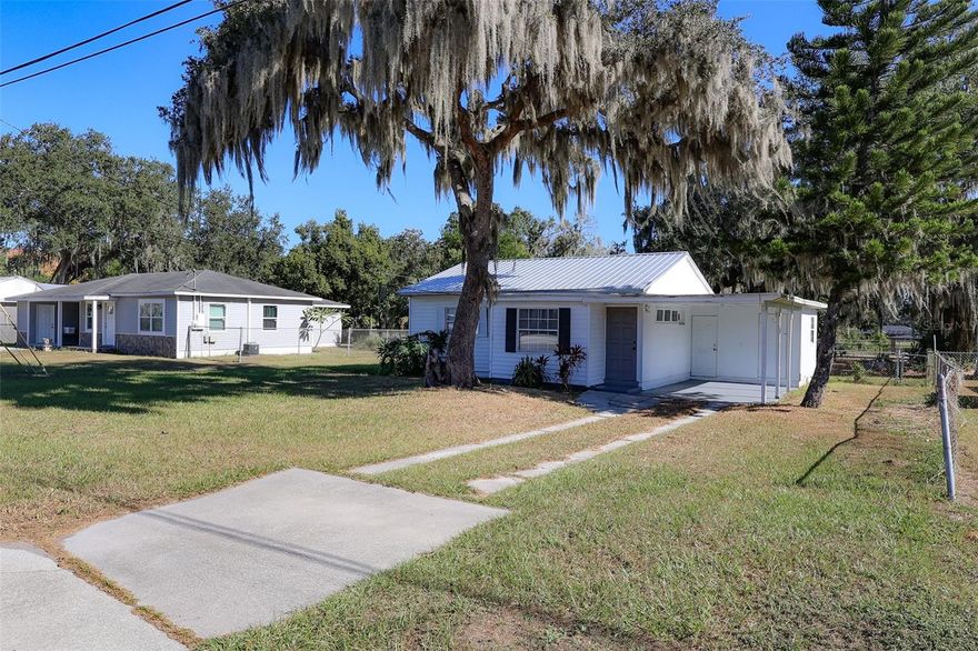 1950 E Valencia Drive in Bartow, Florida, is a charming 3-bedroom, 1-bath starter home featuring a newer metal roof and a fully fenced rear yard with a gate for easy access. Its convenient location places you just minutes from Mary Holland Park, the Bartow Public Library, the Bartow Civic Center, and Mosaic Park, offering plenty of recreation and community amenities nearby. This well-situated property is an excellent opportunity for first-time buyers or anyone seeking a comfortable home close to everything Bartow has to offer.