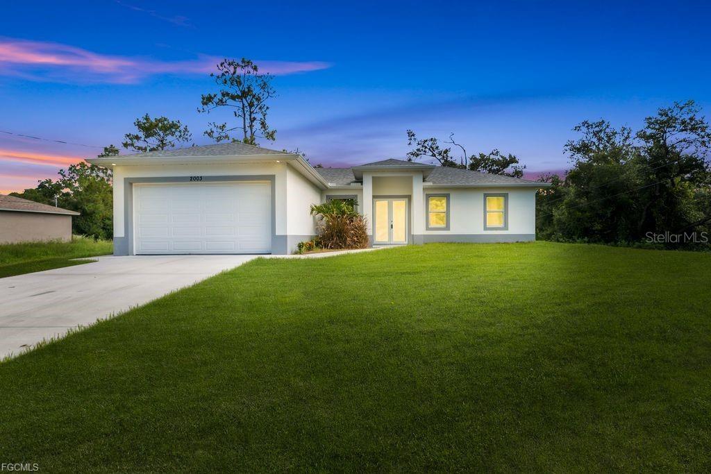 Discover the epitome of contemporary living in this exquisitely crafted new construction home, where architectural finesse meets unparalleled comfort in the heart of flourishing Lehigh Acres. This meticulously designed three-bedroom, two-bathroom residence spans 1,493 square feet of thoughtfully orchestrated living space, showcasing the finest attention to detail that discerning homeowners have come to expect. Step into a world where pristine craftsmanship reigns supreme, from the moment you cross the threshold into gleaming interiors that whisper sophistication. Every corner of this remarkable dwelling reflects the builder's unwavering commitment to quality, featuring premium materials and fixtures that elevate everyday living to extraordinary heights. The seamless flow between spaces creates an atmosphere of effortless elegance, perfect for both intimate gatherings and grand entertaining. The luxurious primary bedroom serves as your personal sanctuary, offering respite from the world while maintaining the home's signature blend of comfort and style. Two additional bedrooms provide versatility for growing families, home offices, or creative studios, each space bathed in natural light that dances across pristine surfaces throughout the day. Nestled within a vibrant community that perfectly balances suburban tranquility with modern convenience, this home places you mere moments from essential amenities. The nearby Frank Mann Preserve beckons nature enthusiasts with its verdant trails and peaceful ambiance, while Jack's Market ensures your daily needs are effortlessly met. Educational excellence thrives in the vicinity, with Donna J. Beasley Technical Academy contributing to the area's reputation for academic achievement. This exceptional property represents more than mere shelter; it embodies a lifestyle where quality construction meets environmental harmony, creating a haven where memories are made and dreams take flight. The neighborhood's welcoming atmosphere and steady growth make this an investment in both comfort and future prosperity.