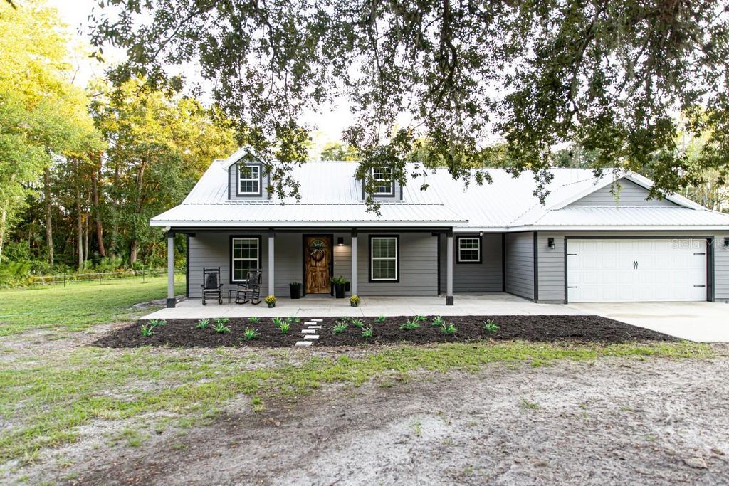 Photo of 1533 County Road 13, Bunnell, FL 32110 (MLS # A4667609)