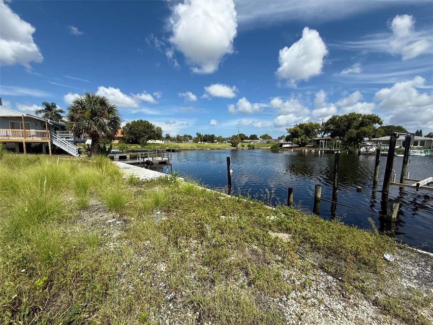 **OWNER FINANCING AVAILABLE WITH QUALIFIED DOWN PAYMENT** Discover the perfect opportunity to build your dream waterfront home on this vacant canal-front lot. Featuring a sturdy seawall already in place, this property offers peace of mind and easy access for future dock or boat lift installation. With direct water frontage, you’ll enjoy scenic views, relaxing breezes, and the chance to design a residence tailored to your lifestyle. Whether you envision a weekend retreat or a year-round home, this lot provides a strong foundation for your vision. Conveniently located near shopping, dining, and area attractions, while still offering a serene waterfront setting, this is a rare chance to create your own piece of paradise. Additional lot at 5247 Boardwalk is also available.