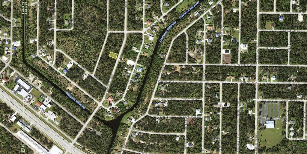 Photo of 16226 Chamberlain Boulevard, Port Charlotte, FL 33954 (MLS # TB8356876)