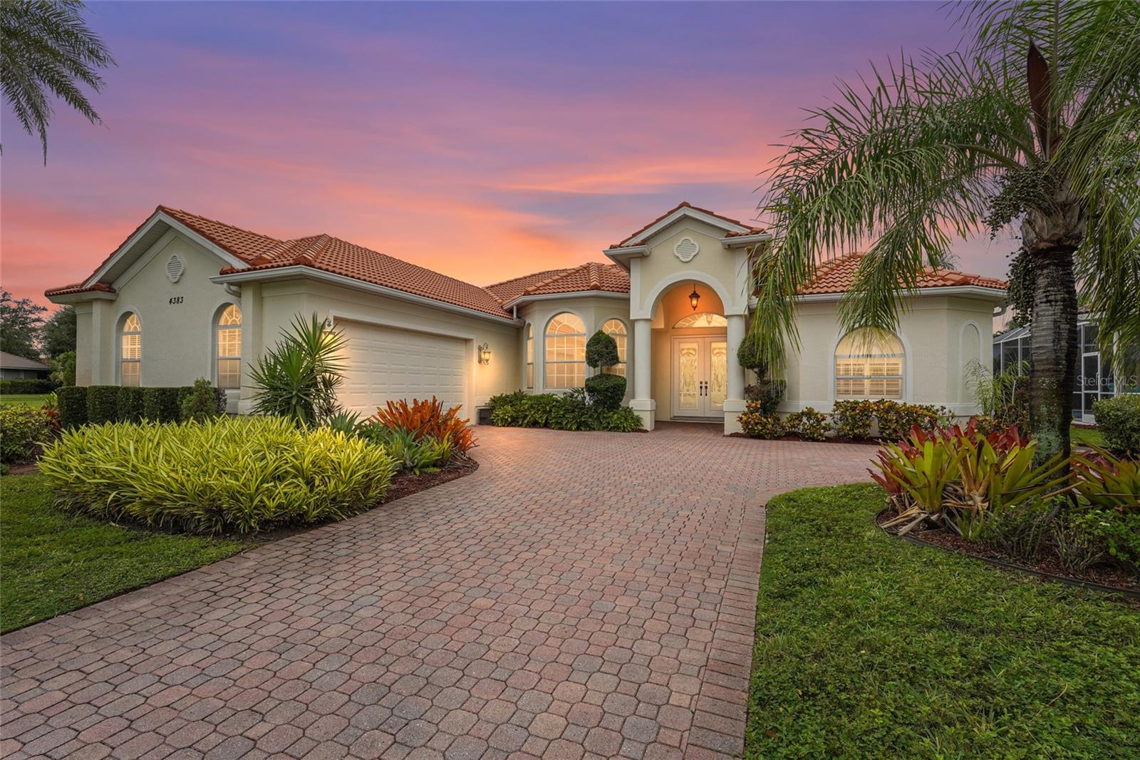 One or more photo(s) has been virtually staged. Mediterranean charm positioned on a serene lakefront homesite, this 3bedroom, 2 and a half bath pool home offers refined living in the gated community of Venetia.
Step inside to soaring ceilings, crown details, and sunlit spaces that transition effortlessly from formal entertaining areas to relaxed gathering rooms. The kitchen is designed for both style and function, featuring an island cooktop, built-in oven, generous cabinetry, and a breakfast bar that opens to the family room.
The primary suite is a private retreat with tranquil water views, lanai access, two walk-in closets, and a spacious bath with dual vanities, soaking tub, and walk-in shower. A thoughtful split floor plan provides two additional bedrooms and bath, ensuring comfort and privacy for guests.
Indoor and outdoor living merge seamlessly as multiple rooms open to the screened lanai. Here, a sparkling pool with spa, and expansive patio overlook the lake, creating an ideal setting for quiet mornings or entertaining at sunset. A brand new tile roof has been paid for and waiting for installation. The transferrable warranty enhances confidence in long-term care.
Residents of Venetia enjoy resort-style amenities including a clubhouse, fitness center, tennis and pickleball courts, bocce, shuffleboard, basketball, and a community pool and spa—all with low HOA fees and no CDD fees. Located just minutes from the pristine Gulf beaches, downtown historic Venice Island, Wellen Park, Atlanta Braves Spring Training Stadium, shopping, and dining, this property offers both a home and a lifestyle.