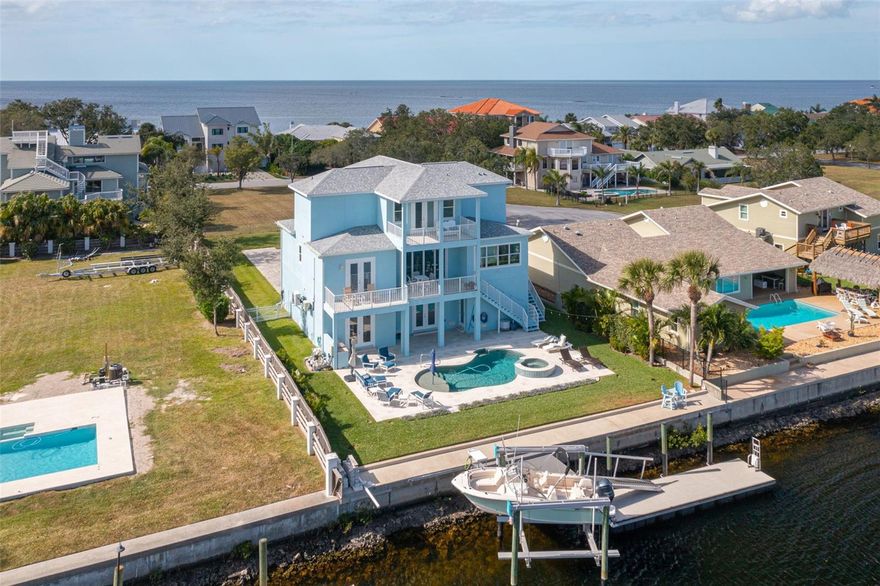 Fully Furnished, three-year-old, custom-built coastal home! A boater's dream location beyond a safe harbor on a wide, and deep canal. It is a 5-minute ride to the Gulf of Mexico. 75' of waterfront featuring a large 32' x 8' floating dock with an extended dock and a 16,000 lb boat lift. This Home has stunning views of both sunrise and sunset. There is an ample brick-paver driveway with plenty of guest parking. The lot is .33 of an acre of tropical landscaping. There is an elegant double-door entry at the garage level for convenient ELEVATOR access. The elevator has access to all 3 floors. The 2nd, main floor has a beautiful open floor plan with a showcase gourmet kitchen. GE Monogram stainless steel appliances, Dolce Vita Quartzite, and butler pantry. There are striking water views through the kitchen past the dining and out to the back, east-facing, deck. The great room has a built-in entertainment center, high ceilings, and french doors leading out to the ample deck. The west-facing office / 4th bedroom has custom-built shelving and a desk area. The 2nd guest bedroom ensuite has a beautiful east-facing water view. The 3rd guest bedroom faces west and is across from the guest bathroom. The laundry room is conveniently located on this floor as well. The entire 3rd floor is dedicated to the elegant main bedroom suite. You exit the elevator into the sitting room with a wet bar/coffee bar. There is a west-facing balcony where you can relax and enjoy the view over the Gulf of Mexico as the sun sets. The bedroom itself has french doors leading out to an east-facing balcony to relax with a cup of coffee in the morning while watching the sunrise. The enormous walk-in custom closet features a closet island. The main suite bathroom has a separate shower, jetted tub, and two separate sink areas with great storage. The ground level has oversized split garages. There is room for the golf cart even with a full-sized vehicle. There is a 10 x 16 fishing room. The ground floor has an ADDITIONAL 809 square feet of finished space, a half bath, and a kitchenette with doors leading out to the sweeping back patio, pool, and outdoor kitchen area. The saltwater pool has a heated spill-over spa and, a beautiful pebble tec finish, and is surrounded by a shell stone patio, which remains cool on your feet. This home is being sold furnished. There are $300,000 plus in upgrades listed on this home. The list is attached for your real estate agent's convenience. The neighborhood has a private beach for $180.00 a year. A clubhouse with too many clubs and activities to list for $125.00 a year is optional. A yacht club for a separate fee. A historic downtown with microbreweries, restaurants, and a historic boutique hotel. There are numerous neighborhood and downtown events throughout the year. There are 19 Marinas within 10 miles. 14 boat-up restaurants within 10 miles. Bring your suitcase and water toys, there is nothing to be done to start living a resort-style life. TURN KEY - FULLY FURNISHED!
The neighborhood has a private beach, clubhouse, and yacht club. Historic downtown with
microbreweries, restaurants, and events. 19 marinas and 14 boat-up restaurants within 10 miles.