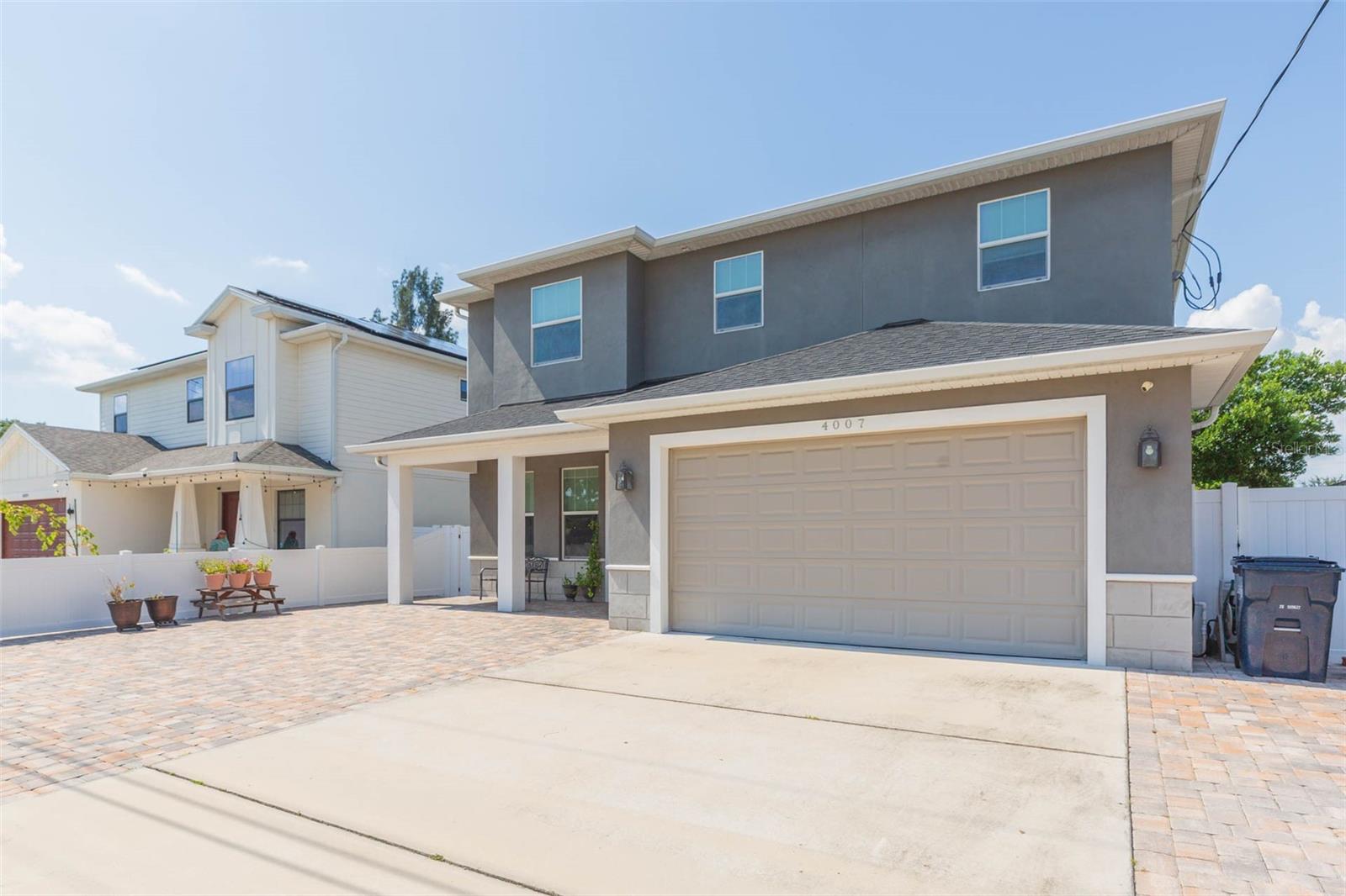 Welcome home in the heart of North Bon Air! Built in 2018, this timeless 5-bedroom, 4-bath residence offers usefully designed space for both everyday living and entertaining. Appreciate modern curb appeal and expansive patio options with pavers galore. Formal living or library / office upon entry. Everything beyond is an open-concept layout with the kitchen and huge breakfast bar overlooking both dining and family rooms… plenty of natural light + high ceilings. This main living area flows seamlessly to the covered patio and private yard – big mango tree too! The first floor also has a versatile bedroom with full bath – perfect for guests or long term hosting. Large owner’s suite is upstairs with two walk-in closets, dual sinks, a garden tub and attractive shower tilework. A Jack and Jill bath connects guestrooms. The back 5th bedroom is oversized with en-suite bath. Everyone gets the space they want within this floorplan. Zoned for Grady, Coleman & Plant. Located just minutes from Midtown, Westshore, International Plaza and Tampa International, unbeatable convenience tucked away on a quiet street. No HOA / CDD. This move-in ready gem is South Tampa Flood Zone X with no past water issues.