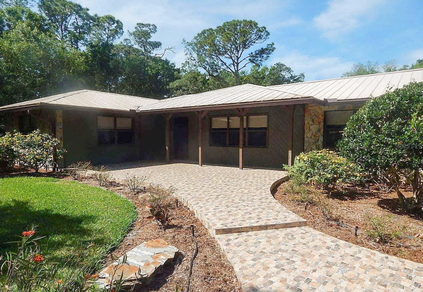 This is one of those special properties that only comes on the Rental market once in awhile. This immaculate 3BR/3BA private home is situated on 1/2 acre - completely private. The third bedroom can be an office with a built in desk or en suite. This spectacular home features: updated gorgeous kitchen, amazing wood and slate flooring, updated appliances, sitting bar, dining area, open floor plan, indoor laundry (washer/dryer included), and stunning open beam ceiling. The master suite is private and has built ins and a fantastic bathroom. The other bathrooms are all beautifully updated with granite and slate as well. Oversized large lanai area with an above ground spa. The grounds are maintained by the Landlord. This is truly a special home. The owner is looking for a long term quiet tenants. There is a full credit, background, employment, and civil check on all tenants.