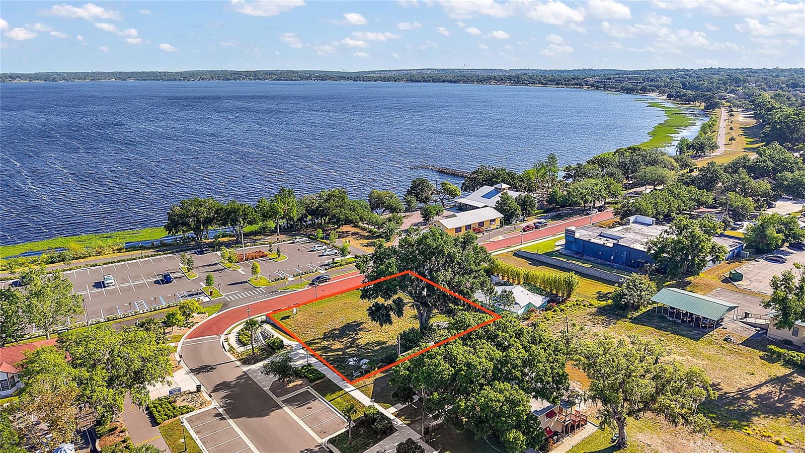Prime downtown Clermont location for Sale, Land lease or build to suit! This corner lot boasts 100' of frontage on Osceola Street looking north over Lake Minneola, and 110' on West Avenue, situated on two of the city's highest traffic streets during events. this site is uniquely suited for a state of the art restaurant with a rooftop entertainment area. Short walking distance to the (Now under Construction) Lumber District, a new multifamily complex (under construction), food court, and entertainment area with live music. Enjoy direct access to Lake Minneola's beachfront with boat parking and in addition to a parking lot with over 80+ parking spaces in front, and street parking as well. This property offers unparalleled visibility and foot traffic. As downtown Clermont continues to grow and develop, this site is poised to be a key player. Owner has invested in extensively in architectural drawings and renderings. Don't miss this opportunity to be part of the city's thriving entertainment community!"