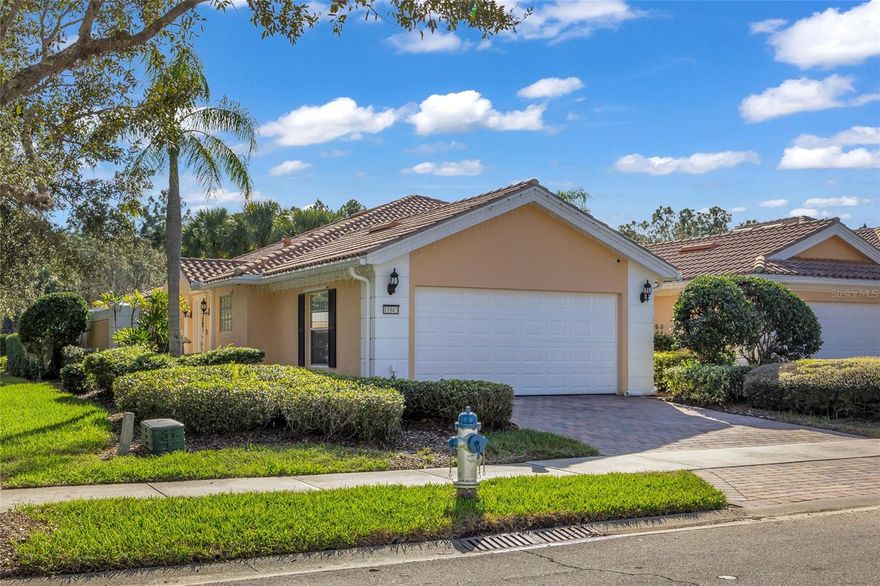 Welcome to this beautifully maintained former model home located in the highly sought-after VillageWalk at Lake Nona, a premier gated, maintenance-free community. This charming residence features 2 bedrooms, 2 full bathrooms, and a 2-car garage, complete with a private pool ideal for relaxing or entertaining.  The home offers numerous upgrades including a new AC (2022), new shutters throughout, a Nest thermostat, and a security system with three cameras. The garage is enhanced with epoxy flooring and custom cabinets, providing exceptional storage and functionality.  VillageWalk at Lake Nona delivers true resort-style living with outstanding amenities, including tennis courts, basketball court, pickleball, state-of-the-art fitness center, on-site gas station, lap pool, resort-style pool, deli/café, and miles of scenic walking trails. The community is zoned for A-rated schools and is conveniently located near Medical City, the VA hospital, dining, shopping, and major highways.  The HOA fee includes cable and internet, lawn care, exterior paint, and roof pressure washing, allowing for truly low-maintenance living.  Bonus opportunity: This home qualifies for a VA assumable loan at an attractive 3.5% interest rate (buyer to verify eligibility and lender approval), offering a significant advantage in today’s market.  Don’t miss this exceptional opportunity to enjoy comfort, convenience, and the Lake Nona lifestyle.