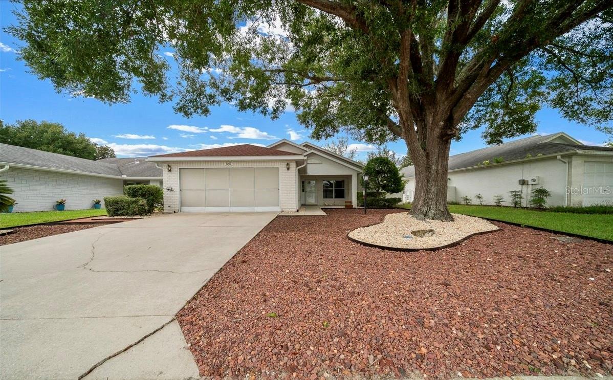 Nestled in the heart of the desirable 55+ community of On Top of the World, this 3-bedroom, 2-bath home with a 2-car garage offers 2,246 square feet of well-designed living space, featuring a split floor plan that balances privacy and comfort while providing an inviting layout for everyday living. Upon entry two guest bedrooms are positioned on each side of the foyer, with a full guest bath conveniently nearby. Just down the hall, the formal dining room is highlighted by multiple skylights that fill the space with natural light. The kitchen features abundant cabinet and counter space, a pantry and a breakfast nook. The expansive living room serves as the centerpiece of the home and has a door that leads out to a beautifully landscaped patio perfect for enjoying your morning coffee. An oversized bonus room off the living room with built-in shelving and a Murphy bed offers versatility, whether used as a second living space, guest quarters or hobby room the possibilities are endless. The spacious primary suite includes an en-suite bath with a tiled walk-in shower and oversized walk-in closet. This home features a roof replaced in 2014 & an HVAC system updated in 2015, for added peace of mind a 1-year home warranty will be included at closing. As part of On Top of the World, residents enjoy an unmatched lifestyle with access to multiple pools, fitness centers, dog parks, tennis courts, shuffleboard, golf courses, RC Field, weekly activities and so much more—all within a community that also offers golf cart access to nearby restaurants and shopping. Schedule your private showing and see the possibilities this home has to offer!