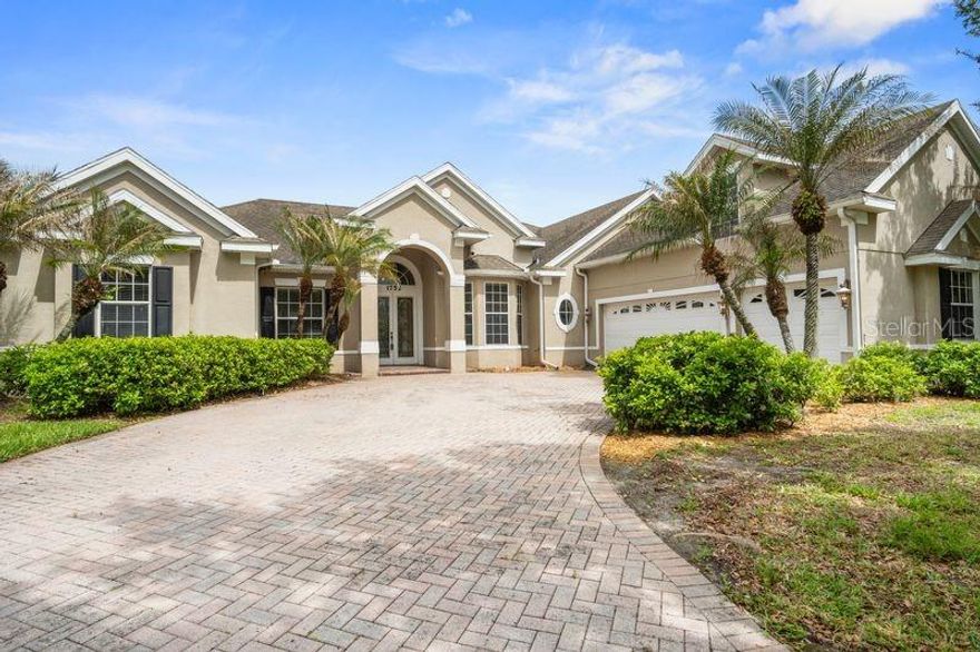 This home sits on a Premium lot in the prestigious gated Kissimmee Bay Country Club Golf Course. Features 3 killer private views over looking EAST LAKE TOHO to the right, the 16th tee box & fairway to the left, with direct private wooded green space views. This custom built home features 3376 sq. ft. and highlights a perfect second floor in-law quarters with full bath, game room, or your 5th bedroom for a young adult for some extra privacy. A perfect split bedroom planned home, formal dinning room ,living room and a large family room that opens up with family room / kitchen entertaining in mind. The custom designed kitchen has been updated with newer cabinetry, pull out shelves, granite counters & peninsula island for extra bar stool seating. The primary suite leaves you in awe, large enough for a sitting area, crown moldings, his and hers closets, both his and hers granite vanities, and a large walk in tiled shower. This home has 12 ft. ceilings which makes it look and feel even larger, 5.5 inch base boards and custom built tray ceilings with lights in the living and dining room. Split HVAC systems and 2 water heaters for conserving your air and hot water when not using a particular part of the home. A rare longer brick paver drive way, with side entry 3 car extended garage for your cars and toys. A smart buy home at this offered 177 a sq. ft. price leaves plenty of dollars for remodeling, updates that you desire, and still in line with other homes in the community. Live your best life here at Kissimmee Bay County Club, this resort style community features private dry dock boat storage, with private boat launch into EAST LAKE TOHO. Clay tennis courts, gated entry, a a semi private professionally designed golf course by Lloyd Clifton designed course, a top golf designer in the world. You can belong or pay as you play. Take your golf cart to the club house for cocktails and meet the neighbors, or have dinner specials offered for the community in the restaurant. If you have an RV - not to worry, KB has storage for that as well. Besides all the amenities offered ,The HOA also includes wireless internet and cable included in your HOA. You can take your boat with family skiing on the lake, then pull up after a day of fun & dock it at the St. Cloud water front marina for lunch or dinner.  If you enjoy mingling , this community is Special, with  events at times throughout the year for the neighbors and holiday parties as well in the club house, or at the community park building for outside parties. Call with questions, im always here to help. You will love living here.