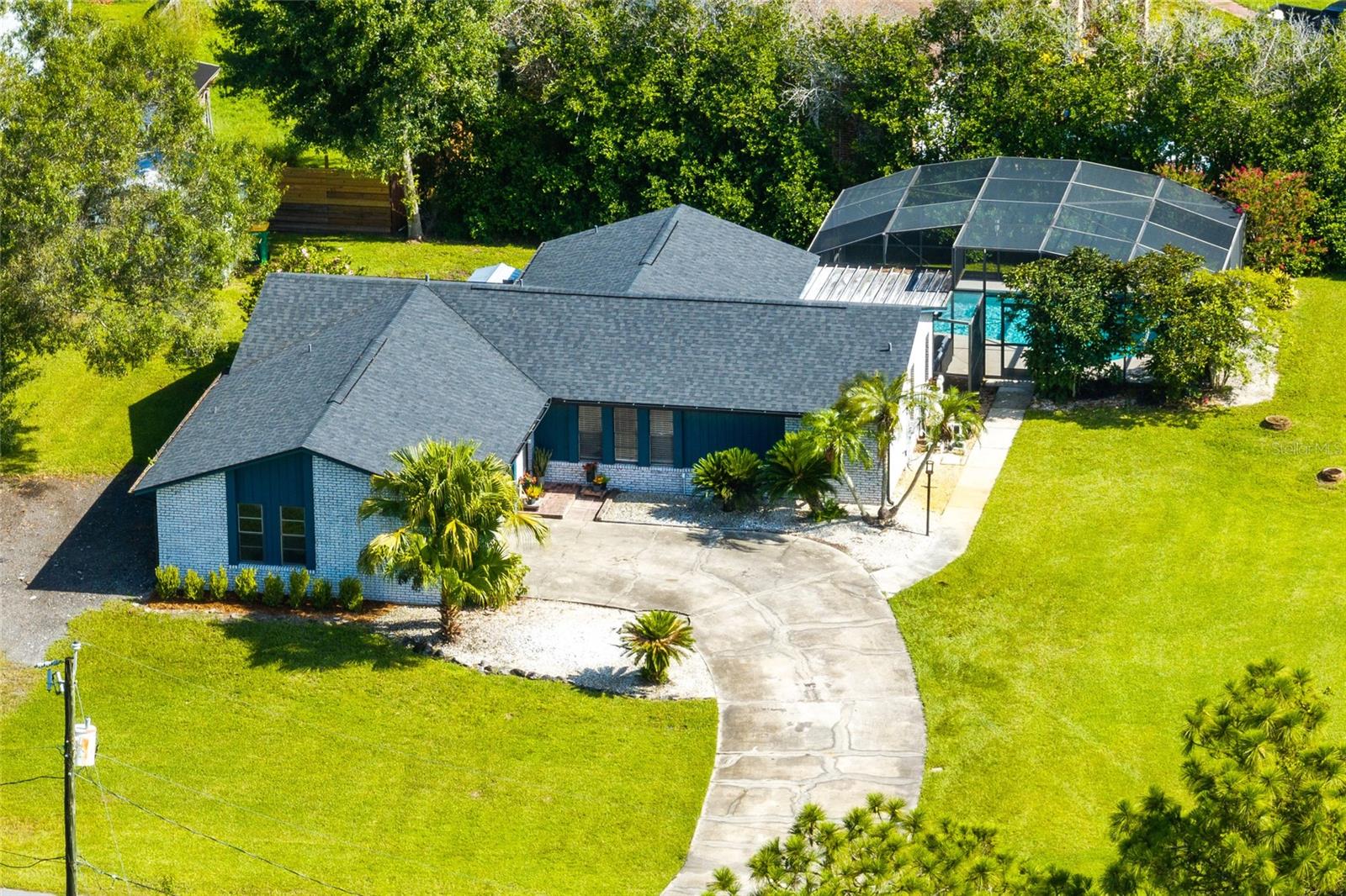 Welcome to this beautifully updated true brick pool home nestled on a spacious corner lot in Saint Cloud, FL with no HOA! Step inside to discover a stunning kitchen remodel completed in 2021, featuring black stainless steel appliances, custom cabinetry, and modern finishes that make entertaining a breeze. The primary bathroom was tastefully renovated in 2020, showcasing a sleek walk-in tiled shower and contemporary design. Enjoy peace of mind with a new roof installed in 2022 and easy maintenance with tile flooring throughout. The split floor plan offers privacy and functionality, while the open living areas flow seamlessly to the outdoors. Out back, unwind in your screened saltwater pool and patio—perfect for year-round Florida living. With plenty of space to relax or entertain, this home checks all the boxes for style, comfort, and location. Don’t miss this exceptional opportunity just minutes from schools, shopping, and major highways—schedule your private showing today!