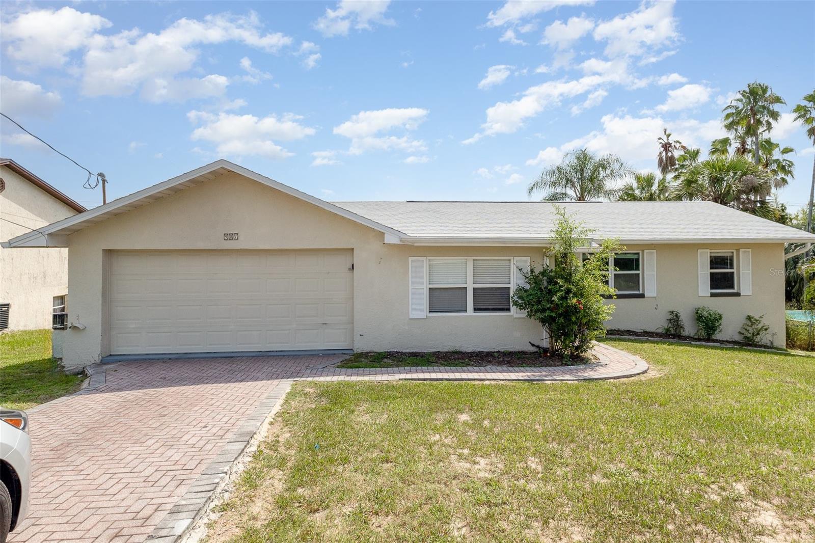 Welcome to this inviting single-story home featuring three spacious bedrooms and a walk-out basement, perfectly situated to take in breathtaking views of Lake Marie. From the moment you step inside, you’ll appreciate the neutral interior paint, wood laminate flooring, and bright, open layout. The Florida Room is a standout feature, offering panoramic lake views and a serene space to relax year-round. A covered patio and rear stairs lead directly into the enclosed Florida Room, seamlessly blending indoor and outdoor living. Enjoy meals in the dining area filled with natural light, or retreat to the cozy living space. The kitchen comes fully equipped—all appliances are included, making this home truly move-in ready. Downstairs, the walk-out basement offers additional space with laundry hook-ups and endless potential for customization. The front and backyard has plenty of room for gardening, entertaining, or simply enjoying the peaceful surroundings. Whether you're looking for a permanent residence or a vacation retreat, this home delivers comfort, charm, and unforgettable views.