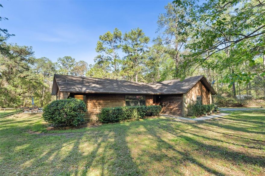 Located off scenic Millhopper Road this 5-acre property is located at the end of a dead end street and offers the perfect blend of privacy, space, and charm. Mature landscaping combined with open space makes this an ideal setting for those seeking a peaceful lifestyle with room to grow. Wildlife sightings and the sounds of nature are part of everyday life here. The property is a short drive to grocery, restaurants and retail stores.
The 3 bedroom, 2 bathroom home features a large enclosed sunroom that provides the ideal space to relax and enjoy year-round views of the surrounding property.
Enjoy outdoor living with an in-ground pool perfect for cooling off on warm days or entertaining family and friends in your own private 
retreat.
The fully fenced property features a barn with two stalls, tack room and loft that is perfect for horse enthusiasts or anyone needing extra storage or workspace.