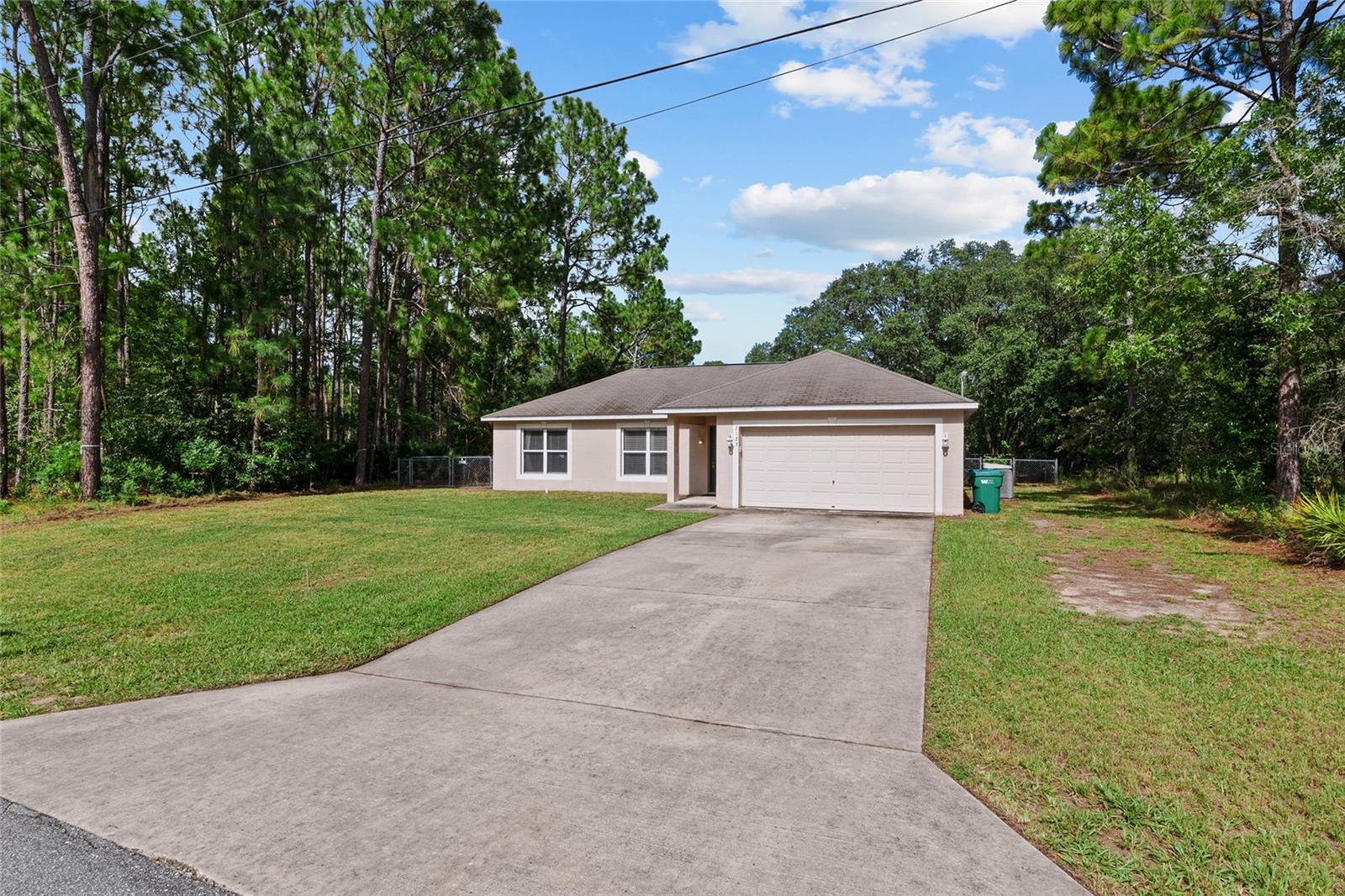 Beautiful Citrus Spring Home, Tallwood offers a 3 bedroom 2 full bath spacious home with two living areas, kitchen and dining areas, Step out onto the ideal porch ideal for relaxing or hosting BBGs with family and friends. chain link fenced back yard, come take a look. Four minutes from an elementary school and a middle school,