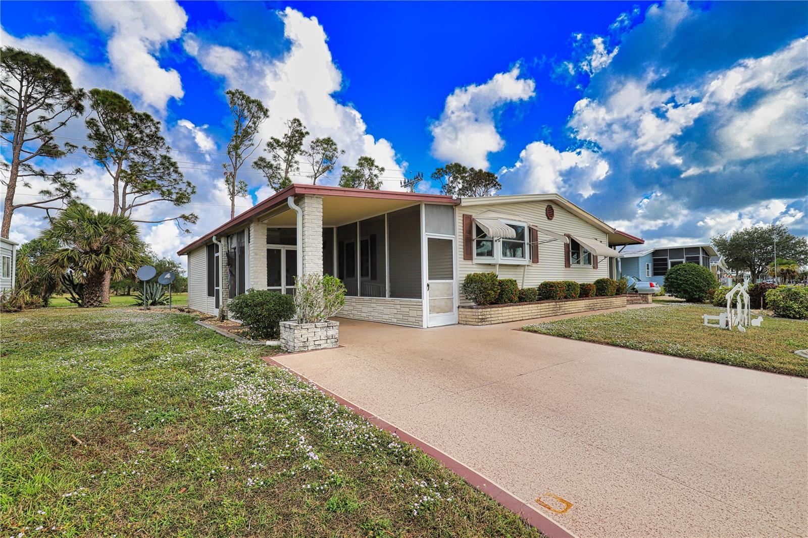This charming home with stunning landscaping is nestled against 40 acres of untouched land in a vibrant 55+ community. This home features a custom-made wheelchair ramp for easy accessibility from the driveway through the spacious lanai and into the home. The kitchen / dining room / living room combination open to a large Florida Room that is under air and is perfect for entertaining friends and family. There are wood beams on the ceiling and luxury vinyl throughout for added touches. Both bedrooms and bathrooms are substantial in size with the washer/dryer located in the guest closet for added convenience. This is a must-see and is located in the pet area so your furry friend will enjoy paradise too! This is the perfect house to update, make your own, and live the Florida dream! New roof 2022.
La Casa boasts 974 homes nestled among a variety of native trees with spacious common grounds surrounding our eight lakes. Our lots average a generous 60' by 80'. The ultimate lifestyle on Florida’s Gulf Coast is located between Sarasota and Fort Myers and is a boater's dream with access to the Gulf of Mexico. It is convenient for shopping, sightseeing, golfing, fishing, and boating, as well as all the culture and elegance the Southwest Florida area is noted for. Residents and visitors enjoy the warmth of Southwest Florida winters in a relaxed and unhurried environment far removed from the hustle of Florida’s east coast. You’ll be surrounded by mature lush landscaping which demonstrates the utmost level of care our property receives from residents and management. La Casa may have the best pools in the area. Our crown jewel is an extremely large, 40 X 60-foot swimming pool that is kept at a perfect 87 degrees. Our smaller 20 x 40 pool is quietly nestled between the clubhouse and the Activity Building. Both pools have adjacent hot tubs which are ideal for soaking muscles that are tired from golfing or tennis. Wireless Internet (Wi-Fi) is available at the Clubhouse, Activity Building, and Recreation Hall area where these pools & spas are located, so you can catch some rays while you catch up on your email! Sound enticing? La Casa is a friendly, family community. You will be away from the hustle and bustle except when you want to be part of it. Come for a visit to this self-contained oasis and see for yourself why La Casa is the ultimate destination for both snowbirds and year-round residents!