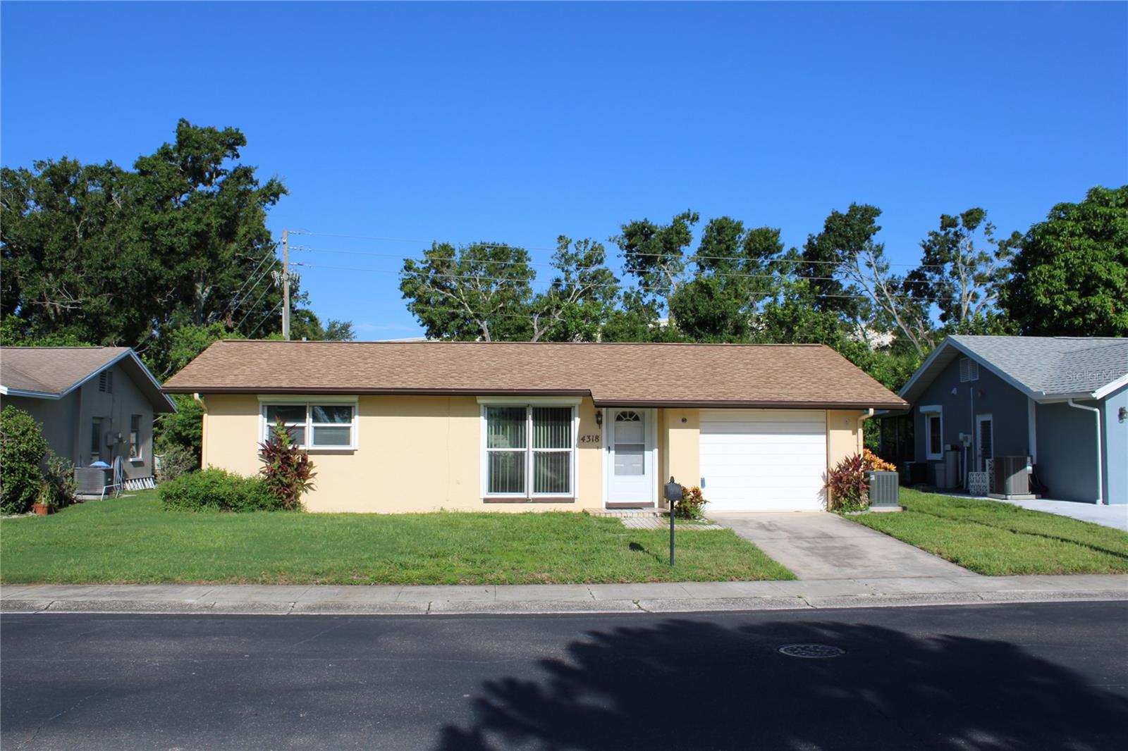 Welcome to your Clearwater Florida 55+ beautiful community. This home is in need of painting, carpet, kitchen and bathroom spruced up and some smoke eater. All the big ticket items have been replaced. The roof was brand new March 2020. New AC system and windows installed middle of 2020, new refrigerator 2024. Home is in a non-flood zone and has hurricane shutters, perfect to ride the storms out. Your monthly $280. maintenance fee covers lawn service, Internet, basic cable, water, sewer, trash, clubhouse and heated pool. Your new home needs some TLC and has a bit of a smoke smell. The location is what really makes this home great. You can get to the beach, restaurants, airports and great shopping very quickly. Make that call now and see your new home today!!!