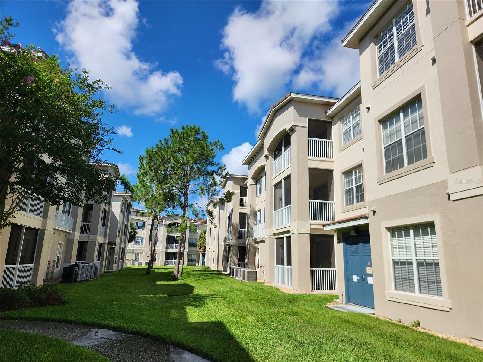 Newly Renovated! This is a cozy and very spacious 3-bedroom/2-bath condo in the desirable Flora Ridge gated community on the 3rd floor with convenient elevator access. Featuring split floor plan, luxury vinyl flooring throughout the unit and lots of natural light. The kitchen has a breakfast nook, new sink, faucet and stainless-steel range. Ceiling fan is in the living room and each bedroom. Laundry room has washer and dryer included. Primary suite features a large walk-in closet, a very large bathroom with his and her sink. The screened-in patio is perfect for relaxing and entertaining family and friends. The community features a pool, parks and walking trail. Located near major highways with easy access to Disney, restaurants, shopping, many Attractions and entertainment. Rent includes, assigned covered parking, trash, sewer and lawn care. This one is just waiting for you to call home!!