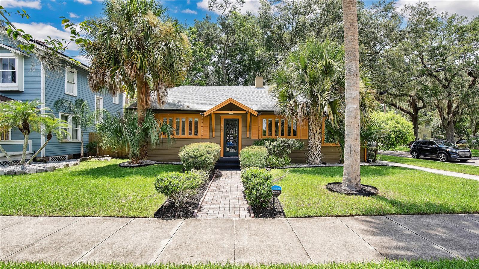 Currently, a part time thriving Airbnb that is also a primary residence for snowbirds. This is a beautifully updated Craftsman cottage in Sanford’s Golf Cart Zone and Historic District. Step onto the brick walk framed by stately palms and feel the pride of ownership that runs throughout. Inside, sunlight pours across warm wood style floors, a classic fireplace anchors the living room, and a fresh white palette lets vintage windows and trim shine.
The kitchen pairs butcher block counters with crisp shaker cabinets and stainless appliances, while both baths boast stylish tile and modern fixtures. Two true bedrooms sit on a quiet wing, and the sunroom/office/bedroom (off the living room), awaits your imagination. Use it for remote work, game nights, art projects, or as an extra bedroom when guests arrive.
Low-maintenance gravel parking, roof ('22) and new gutters, updated plumbing and electrical systems, and a fenced side yard keep expenses minimal and peace of mind high.
From the front porch you are less than a mile by cart, bike, or easy walk to Historic Downtown Sanford, where award-winning restaurants, craft breweries, coffee roasters, live music, and year-round festivals fill brick streets beside the scenic RiverWalk on Lake?Monroe. RiverWalk expansions continue to add parks and trails that link residents to the waterfront and regional paths, and Sanford’s official Golf Cart Zone lets you register a cart and cruise local streets with ease.
Commuters value quick access to SunRail, I-4, and Sanford International Airport, while weekend adventurers can launch a boat, join a craft beer tour, or browse the farmers market without ever starting a car.
Whether you seek an inviting home base, proven income from short-term rentals, or a seamless blend of both, this classic bungalow delivers unmatched flexibility, walkable charm, and the vibrant Sanford lifestyle. Furniture negotiable. Schedule your private showing today.