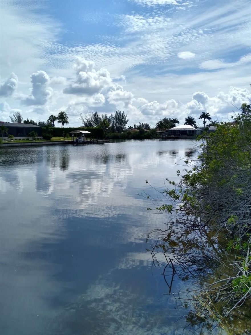 Beautifull lot offers a unique opportunity to build the home of your dreams, Situated in Cape Coral a quiet area, with Canal Access, this land boasts panoramic views and a convenient location close to local amenities. With ample space to design and build, this lot is perfect for those looking to create their own personal paradise. Don't miss the chance to turn this land into your HOME!!