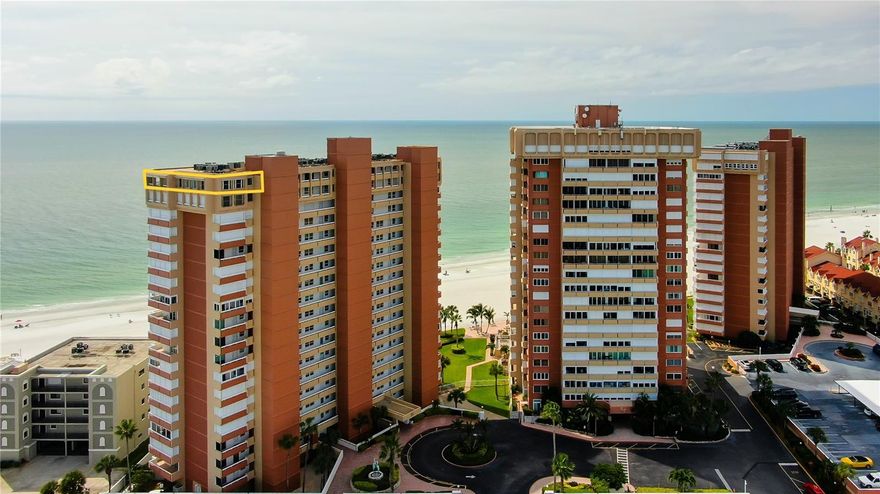 PENTHOUSE 18TH FLOOR SOUTHWEST CORNER UNOBSTRUCTED PANORAMIC AMAZING WATERVIEWS!                                          The Redington Shores Towers are nestled on 6.88 acres, distinguished by its 600 linear feet of pristine sand beachfront, high rise condos, and all the allure of the crystal-clear turquoise waters of the Gulf of Mexico. Gorgeously updated offering 3 bedrooms and 3 baths with the most sought-after direct view of the Gulf of Mexico to an astounding south and southeast view of the beach, intracoastal waterway and downtown St. Petersburg!  From the first moment you step in you are awed by all the large, updated windows letting in natural light which leads to a built-in desk space where the inspiring views will spark your creativity!  Beautiful ceramic tile flows throughout the unit into the open and entertaining focused kitchen which features an island, expansive amounts of granite countertops, custom cabinetry with matching custom range vent hood showcased by an elegantly tiled backsplash, and high-end stainless-steel appliances. Beside the kitchen is a floor to ceiling sliding glass door onto the 370 square foot panoramic terrace that wraps around Penthouse 18A and showcases the dining/living room area with multiple floor to ceiling sliding glass doors and ends with a private sliding glass door into the master bedroom. The sunset views from the terrace are spectacular!!! The dining/living room area affords space for an eight-person dining table highlighted by an elegant chandelier, recessed lighting, designer fans and the ambience of a built-in electric fireplace. The master bedroom offers large multiple windows with direct views of the Gulf of Mexico for that cruise ship-like feel, a large wall-to-wall closet, recessed lighting, designer fan and drapery.  A specially designed split en-suite master bathroom features floor to ceiling porcelain tile and a private door to the oversized tiled shower featuring a rain showerhead, bench seat and linen storage. Another private door leads you to the powder room with his and her sinks with designer faucets and more storage cabinets.  Both additional bedrooms feature recessed lighting, designer fans, ceramic tiled floor, and each has an adjacent bath, one having a jacuzzi tub and the other having a nice walk-in shower. The unit offers a full-sized washer and dryer, updated windows/sliders with electric hurricane shutters, crown molding, 2 skylights, sprinkler system, 2 covered parking spaces #82 & #83, dedicated storage space, Bluetooth speakers in bathrooms, wall mounted TVs in each room including jacuzzi bathroom, and built-in ceiling to floor mirrors. The Redington Shore Towers private residential community features 24/7 surveillance with gated guard entry, private beachfront heated swimming pool with Gulf of Mexico views, picnic area, clubhouse featuring a game room (air hockey, ping pong and pool tables), activities like movie night, bingo and BBQ night with your neighbors, fitness area, and additional laundry facilities. Bike, kayak, and paddleboard storage plus electric vehicle charging stations all on-site. This beachfront community embodies class and sophistication. Drawn to its exclusive lifestyle, shopping experience, fine dining, plus its year-round warm climate sets a stage for one of the kind, vibrant and luxury living.