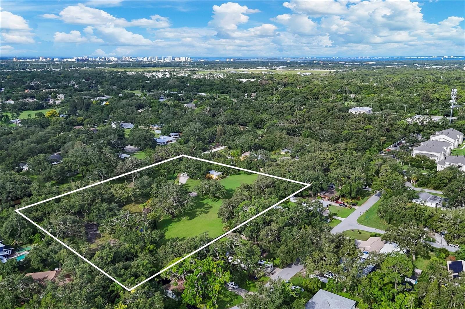 FIRST TO HIT THE MARKET IN OVER 30 YEARS, THIS PRIVATE EXCLUSIVE MAJESTIC 5 ACRE PARCEL IS NOW YOURS FOR THE TAKING.
REZONE AND BUILD MULTIPLE HOMES OR CREATE YOUR DREAM ESTATE ON THIS BEAUTIFUL PIECE OF LAND. ALREADY OFFERED IS A NEWLY REFINISHED 1 BEDROOM 1 BATHROOM GUEST COTTAGE SOURROUNDED BY 100 YEAR OLD OAKS. THIS PRIVATELY GATED PARCEL SITS IN THE HEART OF IT ALL, BEING CLOSE TO BEACHES, THE INTERSTATE, DOWNTOWN, AND THE UTC PLAZA. WHETHER YOU CHOOSE TO BUILD YOUR PERFECT DREAM HOME OR RESIDE IN THE OPEN CONCEPT TREE LINED COTTAGE, THE POSSIBILITIES ARE ENDLESS ON THIS 5 ACRE PARCEL. ENTER YOUR PROPERTY THROUGH A PRIVATE ROAD TO YOUR GATED ENTRANCE TO BE GREETED WITH LUSH LANDSCAPING, CHIRPING BIRDS, THE SOUNDS OF THE RUNNING STREAM, AND THE SHADE OF THE GRAND OAKS. THIS IS ONE OF THE LAST HOLD OUT 5 ACRE PARCELS LEFT CLOSE TO DOWNTOWN SARASOTA.