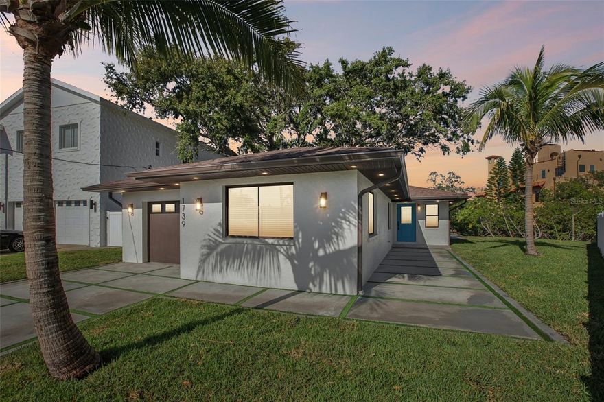 Welcome to 1739 Bayou Grande Blvd NE, a completely renovated 3-bedroom, 2-bath waterfront home with no bridges along one of Northeast St. Petersburg’s most coveted open-water corridors. This move-in-ready residence blends modern updates with unmatched privacy, offering wide-open views framed by protected mangroves and a generous side yard seldom found in waterfront living. Inside, the home features luxury vinyl plank flooring, recessed lighting, and an inviting breakfast nook perfectly positioned to take in the tranquil water views. The tastefully updated kitchen showcases solid wood cabinetry, Corian countertops, and LG stainless-steel appliances. Both bathrooms and all living spaces have been fully refreshed with a clean, modern aesthetic, creating a bright and cohesive interior. Nearly every major system has been replaced and professionally redone and permitted, including a 2025 roof, new AC, new garage doors, new driveway, new doors, updated landscaping, a full irrigation system, soffit lighting, kitchen/baths, and electrical/plumbing. The attached garage provides everyday convenience, while the backyard delivers effortless Florida living with multiple seating areas, lush surroundings, and panoramic views—ideal for relaxing, entertaining, or taking in St. Pete’s famous sunsets. Enjoy direct sailboat water access from your dock, perfect for kayaking, paddleboarding, fishing, or simply unwinding at the water’s edge. Located in the heart of NE St. Pete, this home puts you minutes from downtown St. Pete, award-winning waterfront parks, boat ramps, local restaurants, coffee shops, and the vibrant energy of 4th Street and Shore Acres. Fantastic schools, walkable neighborhoods, and quick access to Tampa and the beaches make this one of the most desirable areas on the west coast of Florida. A truly must-see property offering coastal living at its finest—privacy, views, and a completely reimagined home ready for its next chapter.