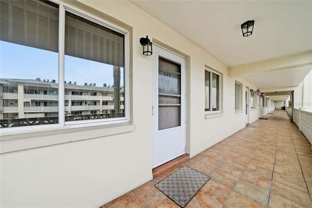 Photo of 1235 S Highland Avenue #3-203, Clearwater, FL 33756 (MLS # TB8523567)