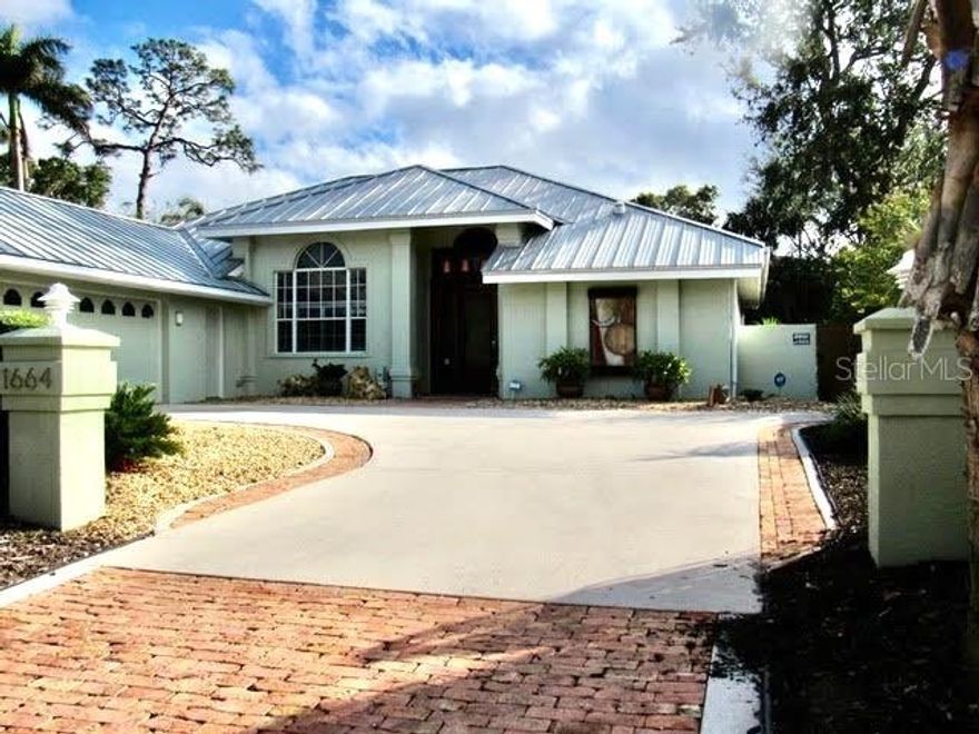 Superb location on an oversized lot! Built in 1998, this meticulously maintained 4 bedroom, 3.5-bathroom home checks all the boxes. The house is well-positioned on the property, maximizing both outdoor space and privacy. Notable features include solar pool heater and pump, metal roof, a single-story split-bedroom floor plan, two living areas, an office and high ceilings throughout and a side-entry oversized two car garage. Situated just blocks from Southside Village and the downtown Sarasota Bayfront.