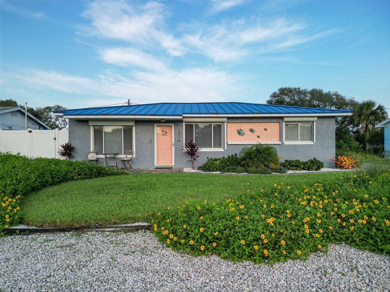 Lovely bungalow just steps to beach access and walking/biking distance to Flagler Ave, shopping, and restaurants. The home has been well maintained and offers a split bedroom plan with spacious living room/dining room combo. Stepping into the backyard you have a serene screened patio, outdoor shower, fire pit, additional covered storage, and beautiful landscaping. Raised seem metal roof, brand new mini split in primary bedroom, hurricane shutters, laundry inside, stainless steel appliances, and LVP throughout 100% waterproof with lifetime warranty. Southard Ave is a peaceful street in the heart of beachside. Furniture is negotiable.