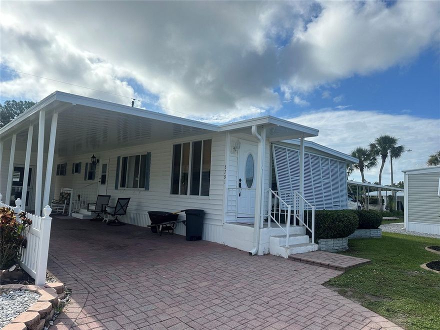 This beautiful doublewide home is located in Japanese Gardens, an active 55+ community in Venice, FL. The community is located approximately 2 miles to Manasota Beach and close to both downtown Venice and Englewood.  The home has been well maintained and is located off a dead end. The kitchen has updated cabinetry and counters and a breakfast bar. The living and dining room is spacious. A great place to entertain! The Florida Room is enclosed with it's own wall unit a/c. Although the home is listed as only 1 bedroom, there is a another room being used as a second bedroom. It does not have a closet, but it has plenty of space to add one. This room is spacious with a door leading outside. The large master bedroom has two walk in closets and an en-suite bathroom. The extended shed houses the washer and dyer and adds additional storage. The home is located in the most popular section of Japanese Gardens. Situated on the perimeter of the park, there is no back door neighbors and the home is dog friendly!