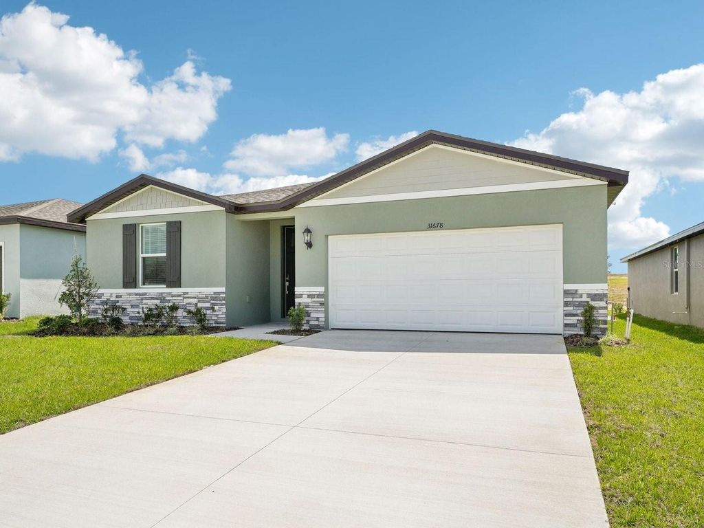 Photo of 31678 Wild Grape Lane, Brooksville, FL 34602 (MLS # O6358486)