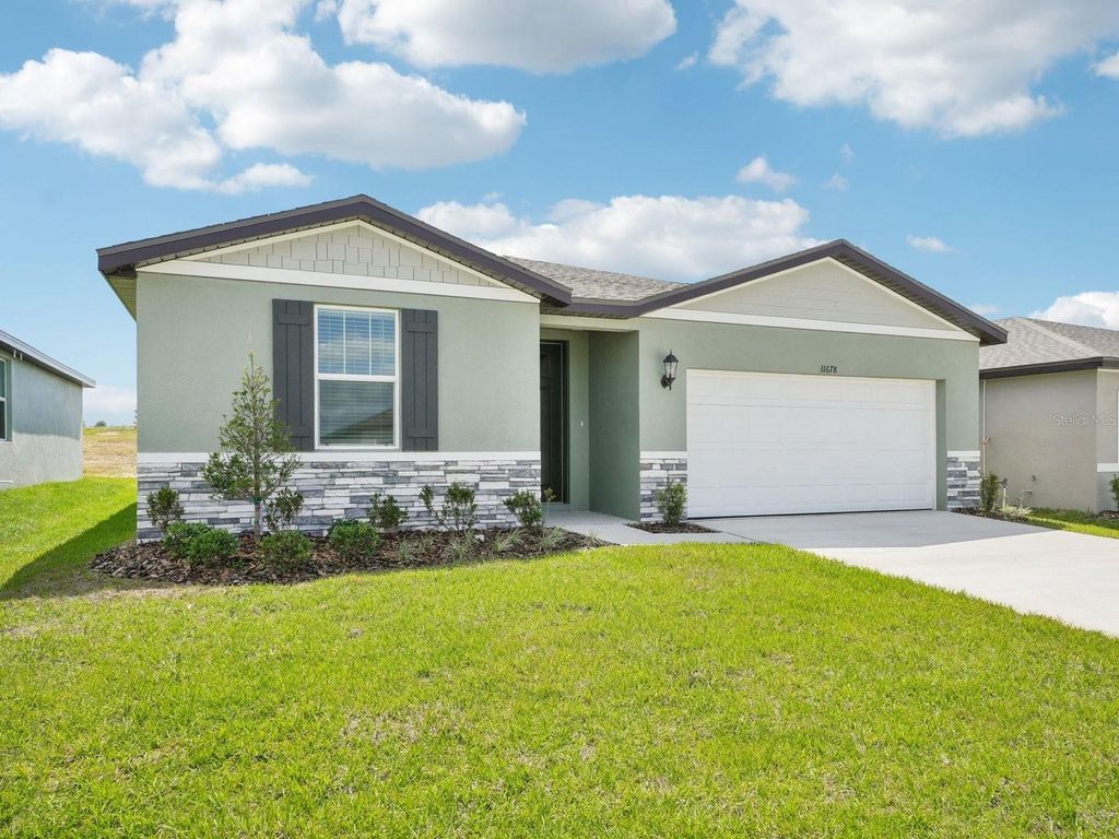 Photo of 31678 Wild Grape Lane, Brooksville, FL 34602 (MLS # O6358486)