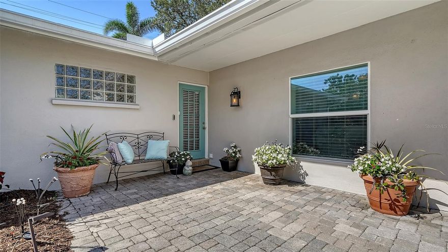 Back on market! Backyard cannot accommodate a pool, however, a courtyard pool in the front of the house is possible. Situated in the sought after neighborhood of Granada, this charming home has been lovingly updated and well maintained. New roof in 2023, New A/C 2023. Close to the beautiful Siesta Key beaches, and downtown, this home has the perfect location. Nearby to Sarasota Hospital, Southside School, Nora Patterson Park, and Southside village, you are minutes to the park to watch sunset or have dinner at any of the upscale restaurants that Southside village offers. The open floor plan makes this home perfect for entertaining, with a wood burning fireplace for cozy evenings by the fire. The courtyard style yard is a wonderful place to hang out on warm evenings or outdoor entertaining. A true three bedroom, three bath also leaves the option of use as a short term rental because of the proximity to beaches and the downtown area.