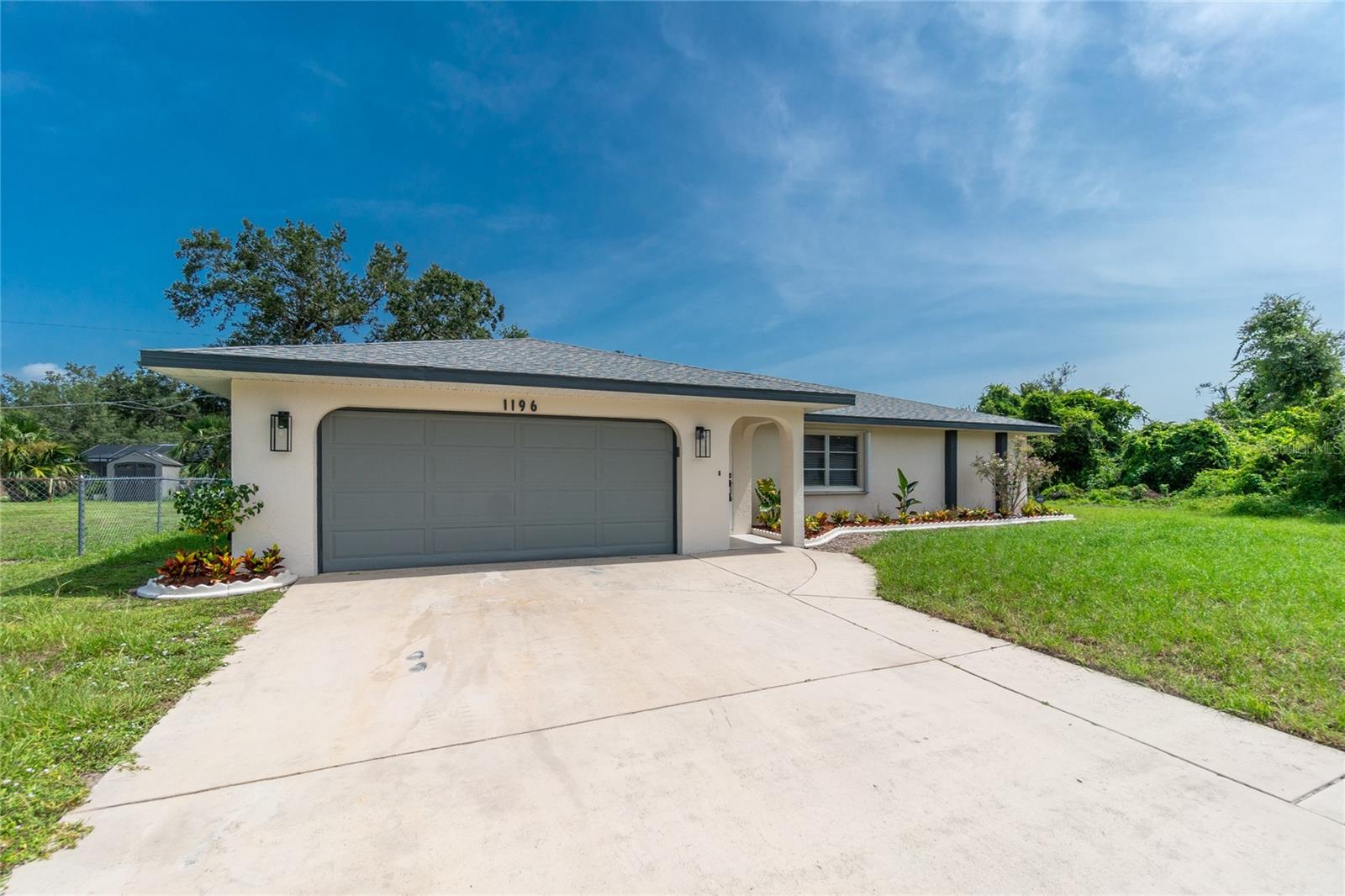 Looking for a completely updated and move-in ready rental? This completely remodeled Port Charlotte home with three bedrooms, two bathrooms, and a two car garage is the home you have been looking for! From the minute you pull into the driveway, you can see the attention to detail that went into this home. This home features a long list of upgrades and is move-in ready. The spacious Living room features tile flooring, new paint, new window treatments, and a modern ceiling fan. The beautifully renovated kitchen has been enhanced with new white wood cabinets, granite countertops, upgraded lighting, new stainless appliances, granite backsplash, large stainless sink, modern faucet, and the list goes on! The dining room boasts new lighting, tile flooring and beautiful view of the large private backyard. The master suite features tile flooring, modern ceiling fan, a walk-in closet with built-ins, new vanity, modern lighting, updated water fixtures,new vanity mirror, and a tiled walk-in shower with glass enclosure. The second bathroom features a new vanity, updated lighting, updated mirror, and a tiled walk-in shower with glass enclosure. Both spare bedrooms have also been enhanced with new tile flooring, modern ceiling fans, and new window treatments. Did I mention that this home also has a 30x11 Florida Room? The outside living space is fantastic large backyard, new landscaping, and more! This updated property is like new and a must see! The location of this property is perfect with only a few minutes’ drive from shopping, golfing, boat ramps, beaches, restaurants, nightlife, and endless entertainment. Schedule a showing today because this home could be gone tomorrow!