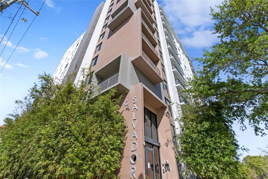 Experience the pinnacle of luxury living in this one-of-a-kind penthouse at The Salvador, a prestigious, Green Certified boutique building with just 74 exclusive residences, ideally situated in the vibrant heart of downtown St. Petersburg. This extraordinary home offers uninterrupted, panoramic views of South Tampa Bay, the Sunshine Skyway Bridge, Albert Whitted Airport, and a yacht-filled marina—delivering an ever-changing waterfront backdrop that defines true coastal elegance. From sunrise to sunset, this custom-designed residence is bathed in natural light through wall-to-wall, floor-to-ceiling windows that span every room, including all bedrooms, creating a seamless connection between indoors and out. With 2,537 square feet of sophisticated living space, this penthouse blends timeless style with
everyday comfort. Upon entering, you’re welcomed into a dramatic foyer that leads to a sunlit great room where water views take center stage. Designed with both form and function in mind, the layout offers privacy between the main entertaining areas. The kitchen and formal dining room are thoughtfully separated from the great room by an elegant partition wall, creating a sense of intimacy while maintaining a natural flow throughout the home. The kitchen itself is a dream for culinary enthusiasts, featuring gas cooking, premium stainless steel appliances, ceiling-height custom cabinetry, and generous counter space. A separate catering prep area adds convenience for those who love to entertain. The private primary suite offers a retreat-like atmosphere with breathtaking bay views, a spacious custom walk-in closet, and a spa-inspired en-suite bath complete with a luxurious jetted soaking tub, a large walk-in shower, dual vanities, and instant hot water. Two well appointed guest bedrooms each include their own full bathrooms, offering comfort and privacy for family or visitors. Additional flexible spaces include a richly styled library (which can be converted into a fourth bedroom), a private home office or den, and a laundry/utility room with built-in smart home features for added efficiency and ease. Refined finishes throughout elevate the experience—10'+ ceilings, designer lighting, beautifully crafted tile flooring, extensive custom cabinetry, and two gas tankless water heaters for on demand hot water. The residence also includes two assigned parking spaces within the secured, access-controlled garage.
Residents of The Salvador enjoy an elevated lifestyle with resort-style amenities on the third floor amenity deck, including a heated saltwater pool and spa, a modern fitness center, stylish clubhouse, outdoor grilling station, cozy fire pit, sculpture garden, and a dog park with wash station. The building offers secured access and a peaceful, private environment while being just steps from everything downtown St. Pete has to offer—award-winning restaurants, waterfront parks, vibrant art galleries, world-class museums, marinas, the St. Pete Pier, and lively markets and events. This is not just a home—it’s a statement in luxury, design, and location. Discover the best of city and bayfront living in one of downtown St. Pete’s most sought-after residences. If you want an alternative to “partition wall,” I can offer “architectural divider” or “tasteful dividing wall” as well!