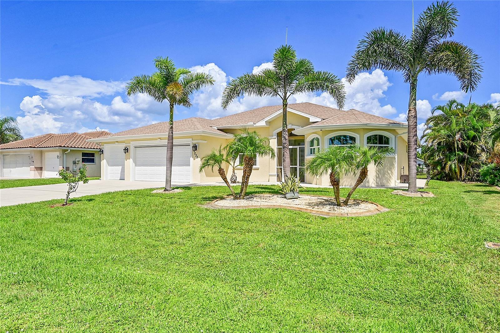 Live the Ultimate Florida Lifestyle in Rotonda West! Welcome to a slice of paradise where Florida truly shines—shimmering emerald waters, world-class fishing, championship golf, powder-soft beaches, and endless sunshine! Just 15 minutes from the elegance of Boca Grande and only 10 minutes to the laid-back vibes of Englewood Beach, this home places you in the heart of it all. Rotonda West itself is a golfer’s dream, boasting three premier golf courses—so tee times are always ready when you are! And when the day winds down, indulge in the area’s renowned dining, coastal adventures, and tropical weather that makes every day feel like vacation. Settle into one of the community’s finest homes, perfectly blending style, function, and luxury. This 3-bedroom, 2-bath canal-front retreat features a three-car garage with dedicated space for your golf cart - ideal for your new lifestyle. The garage even has a new motorized role down screen to help catch the afternoon breeze and still provide the needed privacy. Inside, the chef-inspired kitchen steals the show with rich hardwood cabinetry, gleaming granite countertops, and a center island with a slide-in range with an induction cook-top that makes meal prep feel like you’re hosting your own cooking show. The owner’s suite is a sanctuary with a Roman-style walk-through shower, dual vanities nestled in the granite counter tops, and two walk-in closets—one even equipped with washer/dryer hook-ups for ultimate convenience. (Additional laundry is already set up in the garage if you prefer.) The large en-suite has been fitted with grab bars and a bidet! Step outside to your private heated salt water pool, perfectly situated within a screened-in lanai for year-round enjoyment. A fully fenced backyard ensures your pets have their own paradise too. This home truly sparkles, is move-in ready and waiting for you to start your next chapter in the Florida lifestyle you’ve been dreaming about. Don’t let this one slip away!
