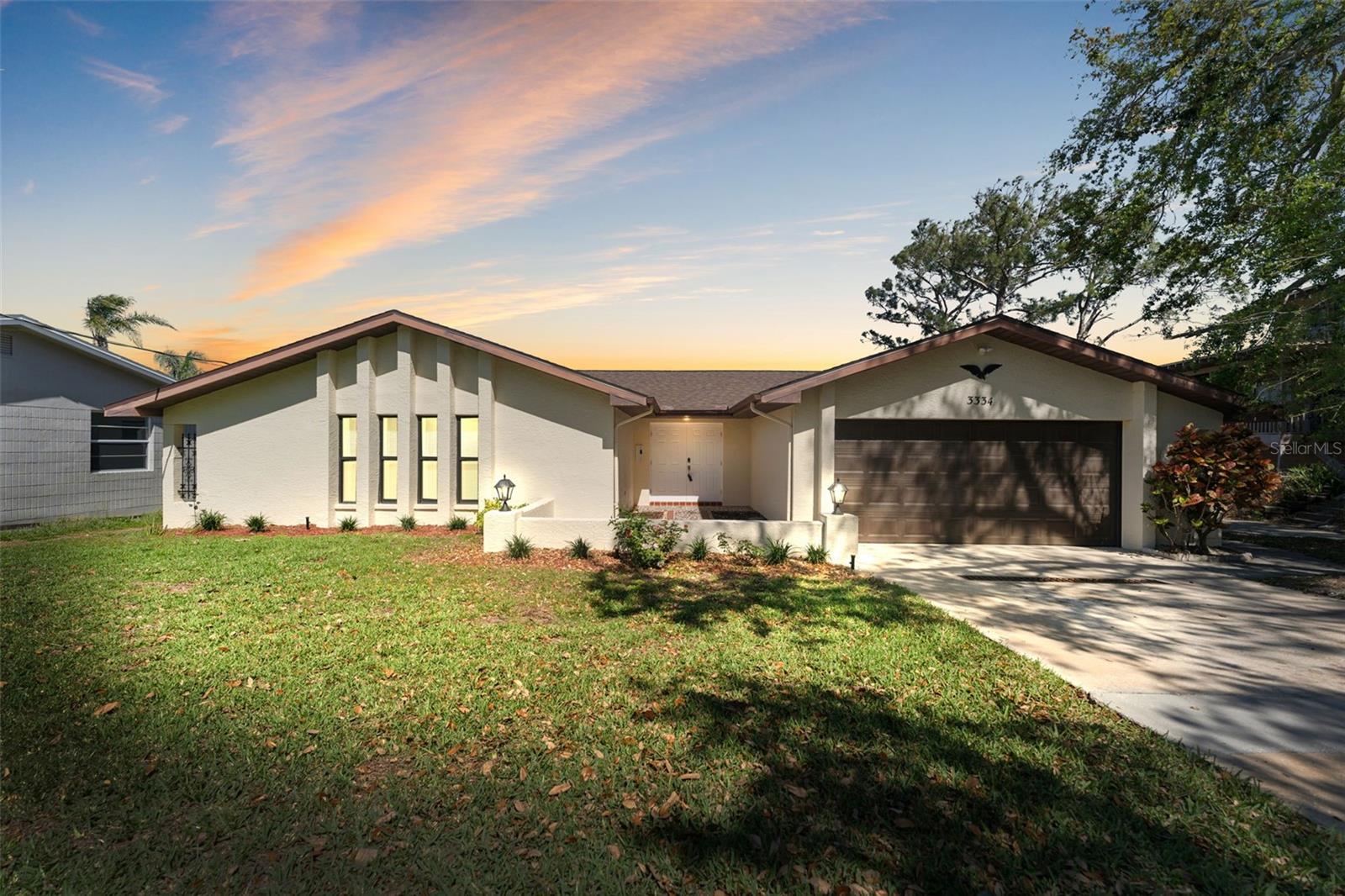 Absolutely stunning and FULLY RENNOVATED 3 BR/2 BA/2 Car Garage WATERFRONT home in cul-de-sac of the highly sought after BAILEYS BLUFF waterfront community. Located directly on a canal with direct access to the Gulf giving you amazing opportunities for boating, diving, fishing, relaxing from your own PRIVATE PIER. This sturdy BLOCK CONSTRUCTION home, with BRAND NEW ROOF (2025), and Newer HVAC (6/2022) has been updated with brand new durable and waterproof contemporary luxury Vinyl plank (LVP) flooring throughout the entire home, completely repainted interior, with a "Chef's Dream" Kitchen featuring: stunning quartz countertops, solid wood cabinetry, high-end stainless-steel appliances, kitchen-island with breakfast bar, and open floor plan kitchen/living room with wood burning fireplace. Complete with vaulted ceilings and formal dining room with lots of natural light and views of the large backyard and waterfront. The bedrooms are all large and have built in closets. The master bedroom has a walk-in closet, and direct views of the water and an ensuite bathroom with his and her sinks and gorgeous tiled walk-in shower. Featuring a fully covered and fully screened outdoor lanai as well as a durable (Hardieâ„¢ deck) outdoor sundeck and large backyard with your own PRIVATE FISHING PIER nestled between mangrove trees where you can watch dolphins swim-by, fish, relax...and enjoy the best that Florida has to offer! Truly a stunning home, our application process is quick and easy so apply today.