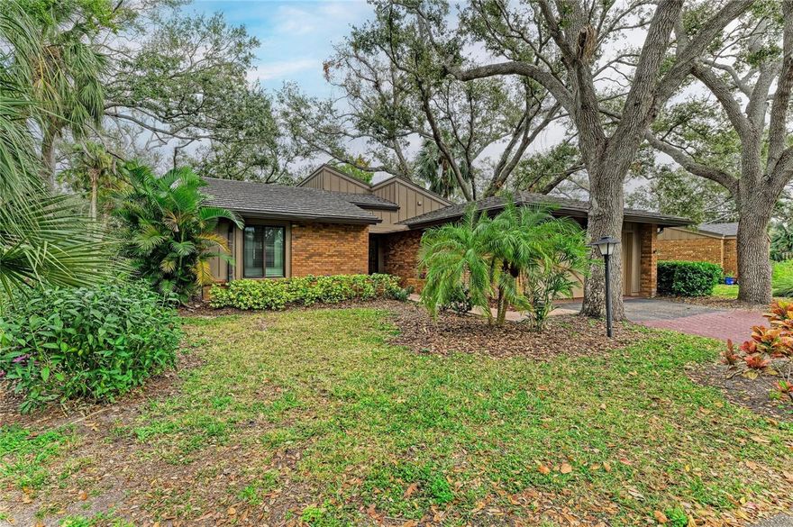 Welcome to a rare find in one of Bradenton’s most popular communities, known for its lush landscaping, mature woods, privacy, and maintenance-free lifestyle. This free-standing single-family home is light, bright, and move-in ready, offering peace of mind with a durable metal shingle roof, majority impact windows and shutters, and a new garage door, all within a quiet, well-kept setting. --- Inside, the home features wood flooring, an inviting open feel filled with natural light, and updated kitchen and bathrooms designed for both style and function. The layout flows effortlessly to a private, screened-in lanai, perfect for relaxing or entertaining while enjoying the peaceful backyard setting. --- Directly across the street is G.T. Bray Park, a premier recreational destination featuring walking and biking trails, playgrounds, Pickleball, tennis, sports fields, dog park, pool, fitness facilities, and more — an incredible extension of your backyard. Just minutes away, Robinson Preserve offers miles of scenic trails and coastal views, while the famous Gulf beaches and Anna Maria Island are a short drive or even bike ride away. --- With shopping, restaurants, medical facilities, and daily essentials close by, and an HOA that handles exterior grounds maintenance, this home offers the perfect blend of comfort, convenience, and the Florida lifestyle. Call to schedule your private showing today!