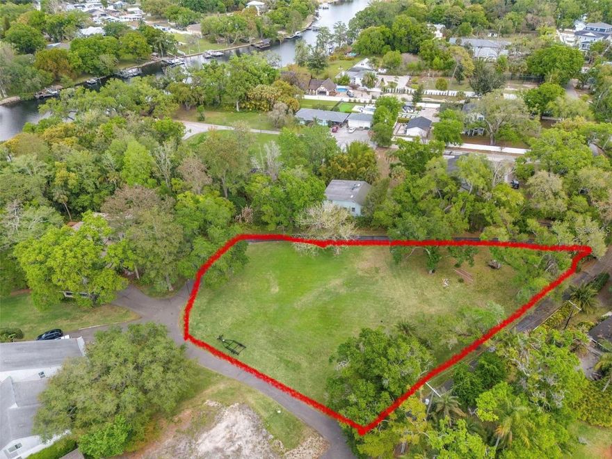 Exceptional opportunity to secure a prime piece of land thats perfect for a huge luxury estate, or 3 spacious new construction homes. With partial river views in one of Seminole Heights most desirable streets, this home is a rare piece of Tampa real estate. This property offers a rare combination of location, water proximity, and development potential, making it ideal for builders, investors, or those looking to build a one of a kind dream home. Positioned at the end of River Terrace, on a cul-de-sac, the lot provides scenic partial views of the river, adding a premium lifestyle element that will significantly enhance future resale value.The true value lies in its potential, this property can accommodate up to three homes, offering a unique opportunity to maximize density and return on investment. Whether you’re planning new construction for resale, long-term rental income, or a boutique development concept, the possibilities here are substantial. Located just minutes from Downtown Tampa, Armature Works, Ybor and the Riverwalk, this area continues to see strong growth, new construction activity, and increasing demand for homes near the water. With close proximity to major roadways, dining, entertainment, and Tampa’s vibrant urban core, this lot offers both lifestyle appeal and strong long-term upside. Opportunities to build multiple homes with river views in central Tampa are extremely limited, this is your chance to capitalize on a high-potential property. Bring your builder, your vision, and unlock the full value of this unique River Terrace opportunity. NOTE: when typing in the address to view the site, its the large round grass patch in the center of the cul-de-sac, NOT the 5924 river house...that portion is getting sub-divided off and not included.