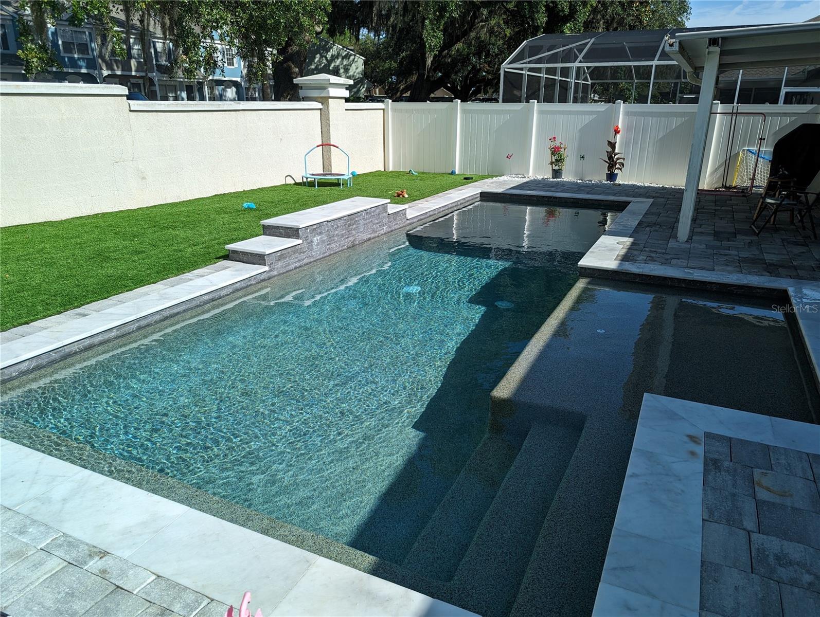 Act fast!  This beautifully renovated one story, 3-bedroom, 2-bath home in Chase Groves is packed with upgrades and ready for immediate move-in! Enjoy a brand-new dream pool with fountains, low-maintenance artificial turf play area, fenced dog yard/walk, and a covered patio overlooking a private backyard framed by majestic oak trees. Inside, vaulted ceilings and an open floor plan create a bright, airy feel, with ceramic tile in main areas and bathrooms, and laminate flooring in all bedrooms. The spacious living and dining areas flow into a well-equipped kitchen with bar-top counter, breakfast bar, oversized pantry, and adjacent laundry. The primary suite features his-and-her closets, garden tub, and separate shower, while the second bath shines with sleek, modern finishes and is shared by the second and third bedrooms. Also acts as a guest bath. The two-car garage is attached to the pantry/kitchen, The garage apron allows extra parking for two vehicles. The entrance way is accentuated by a welcome entry feature alongside an expansive front yard perfect for holiday décor. Upgrades include, 2016 exterior paint, 2017 A/C unit, new vinyl fencing, and irrigation system, 2018 new roof and a 2024 new dream pool and artificial turf make this home a standout! Located minutes from Walmart, top-rated Seminole County schools, shopping, dining, and major highways, 417 and I-4, Sanford Airport, Seminole Town Center, Lake Mary Sun Rail Station. Kitchen appliances & washer/dryer all convey. Room dimensions are approximate. Buyer to Confirm. Listing Agent is related to Seller.