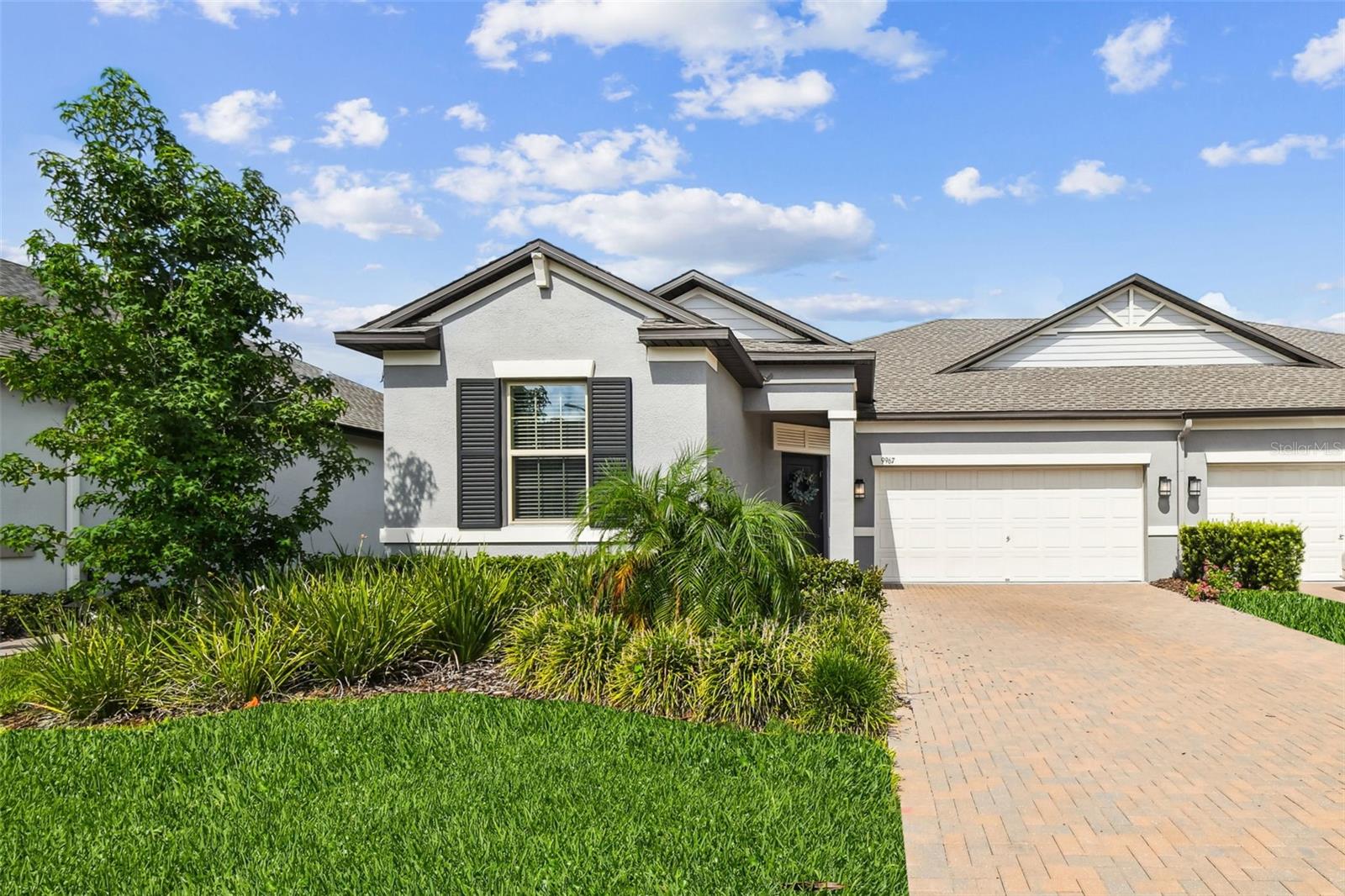 Fabulous VILLA in the sought-after community of Connerton in Land O' Lakes, FL, is up for grabs! Located near the Connerton Elementary school, this home offers 3 bedrooms, 2 full bathrooms, a 2 car garage, and modern updated decor. With 1969 sq ft, the open floor plan and natural light, provides a cozy and comfortable space to call home. Beautiful exterior with covered front porch leads you into a luxurious foyer with crown molding/tray ceiling. 2 bedrooms are tucked away for privacy and full bathroom is available to share. Walking down the foyer, it opens up to the heart of the home. The openess of the living, dining, and kitchen areas is perfect. Large granite center island for additional seating. The kitchen provides stainless steel appliances, is light and bright with a stunning backsplash and great counter space. Large pantry. Owners can relax in the back of the house as the primary bedroom and ensuite are here. Plenty of room for a king sized bed, ensuite offers dual sinks, tiled walk-in shower, and walk-in closet. Granite throughout. Modern wood-like tile flooring throughout main living areas. Open the sliding doors to the covered lanai perfect for relaxing, reading a book, or having morning coffee. Reclaimed water for irrigation. No exterior maintenance for the homeowner as the HOA provides through the dues! Connerton has an ABUNDANCE of amenities and activities to do for all ages. Clubhouse, pool, tennis, fishing, biking/walking trails to name only a few. The location is is very close to access to the interstate, is quick travel to Tampa and Tampa International Airport and the Connerton Publix is right there! Medical, entertainment, fine dining and upscale shopping all within minutes. Highly rated public schools. There are also 2 options for private schools-Countryside Montessori and Land O'Lakes Christian School.